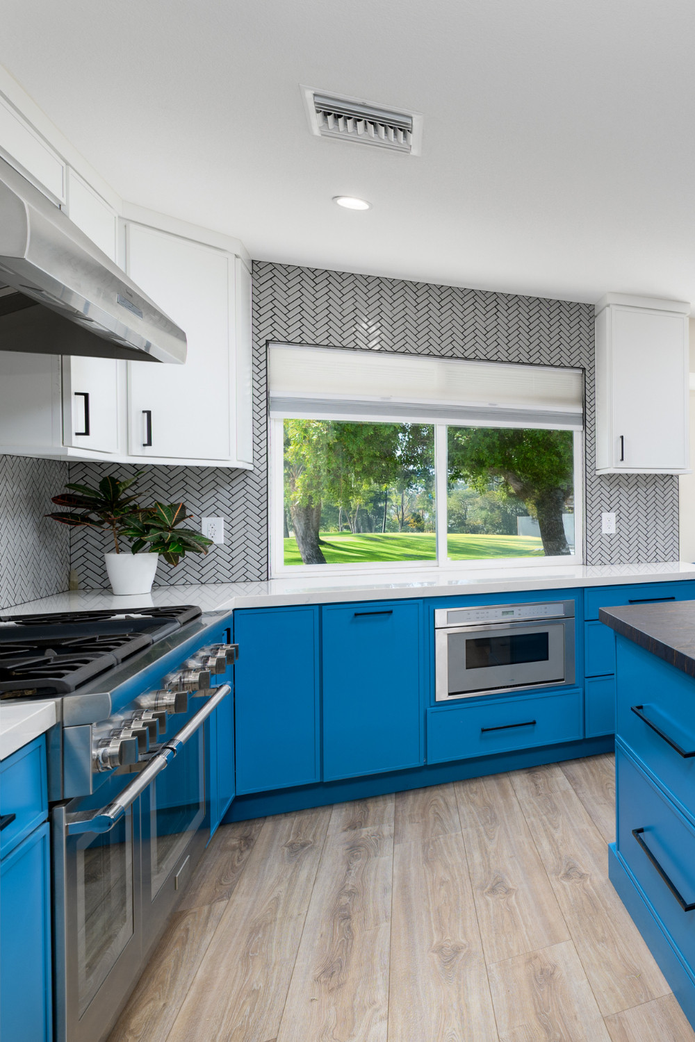 This kitchen is proof that function doesn’t have to be boring. We supplied the custom flat-panel cabinetry in a saturated blue finish for a playful yet modern twist. Paired with crisp white uppers, matte black hardware, and a full-wall herringbone backsplash, the design strikes a stunning balance between statement and sophistication. Large drawers, a built-in microwave, and professional appliances ensure this kitchen works just as hard as it looks good.

Want cabinetry that reflects your style and meets your needs? We’ve got you covered from layout to finish.

#BoldKitchenDesign #BlueCabinetry #ModernKitchenRemodel #CustomCabinetry #KitchenInspiration #FlatPanelCabinets #KitchenStorageSolutions #HerringboneTile #DesignBuildFirm #PinterestKitchen #LTKHome #ColorfulKitchen #FunctionalDesign #CabinetDesign #RemodelReveal #KitchenGoals 

 #LTKHome