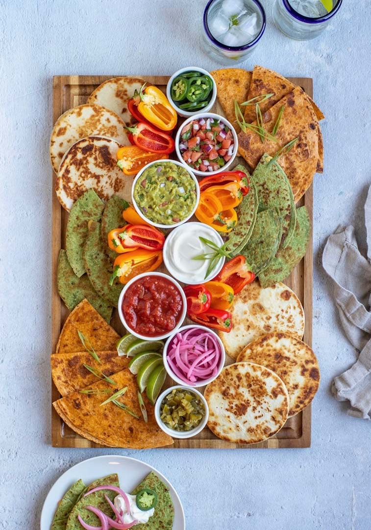 Quesadillas are a classic Mexican comfort food, and, beyond being one of my favorite Mexican-inspired snacks, they are super easy to make. This board is designed to make your next fiesta fun and delicious without all of the fuss of a traditional dinner party–it’s all about the dips and toppings! Also, it pairs really well with my delicious margaritas and this Mexican-Inspired Charcuterie Board.

#LTKfoodie #LTKSeasonal