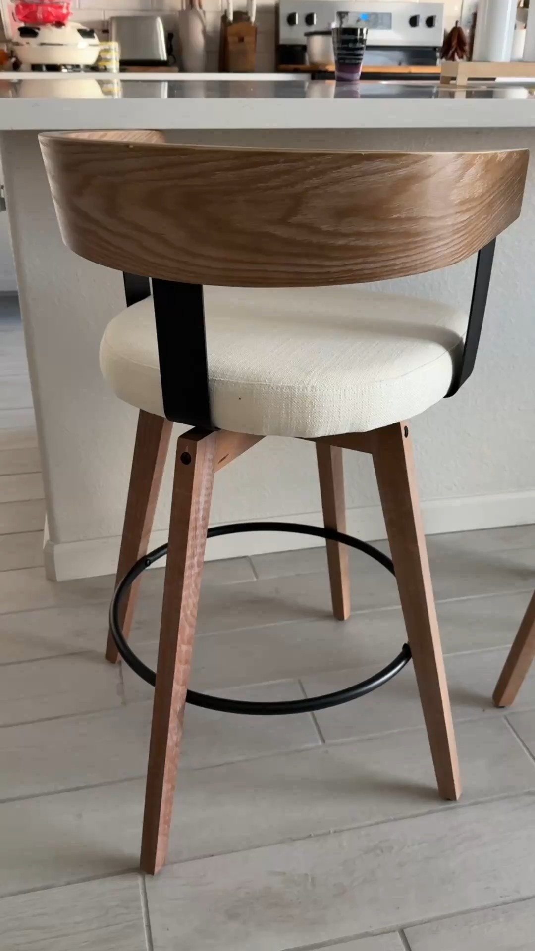 Swivel bar stools with a mix of warm wood tones and black metal 😍 Love the contrast and the clean lines. 

Cushion is medium firmness and the linen upholstery is beautiful! Definitely need to spray these bad boys with my stain repellent 😉

#kitchen
#barstools


#LTKHome