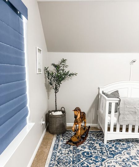 Blue and grey nursery. Simple baby boy nursery style with a white crib, faux olive tree, large grey basket, vintage rocking horse and grey quilt. 

I couldn’t link the exact rocking horse because it’s mine from when I was a little girl, but there are a lot of beautiful ones on Etsy! 

Blue rug, Davinci crib, newton baby mattress, breathable mattress for infants, nearly natural olive tree

#LTKfamily #LTKbaby #LTKhome