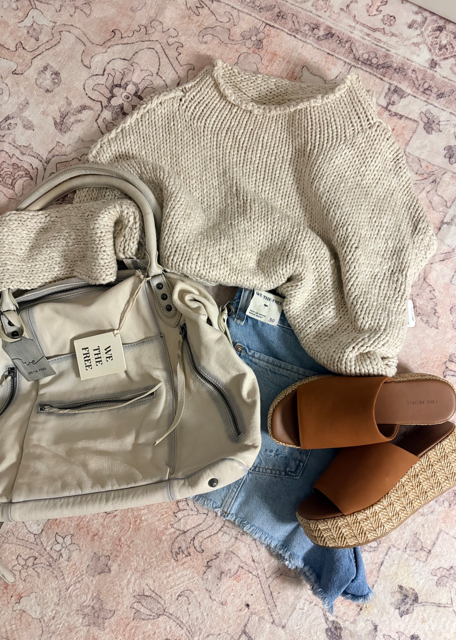 The way Free People just brightens my day 🫶🏼 it should be studied or bottled! 

The Emerson bag is perfect in both sizes, I just like it more oversized.. pictured is the large in Salt 😍 

The Opal sweater is 👩‍🍳 😘 just size up!! Where I’m usually a medium, in this I went xl! 

While they are out of the Raffia Flatforms, they don’t have a bad color in stock! 

#LTKSeasonal #LTKOver40