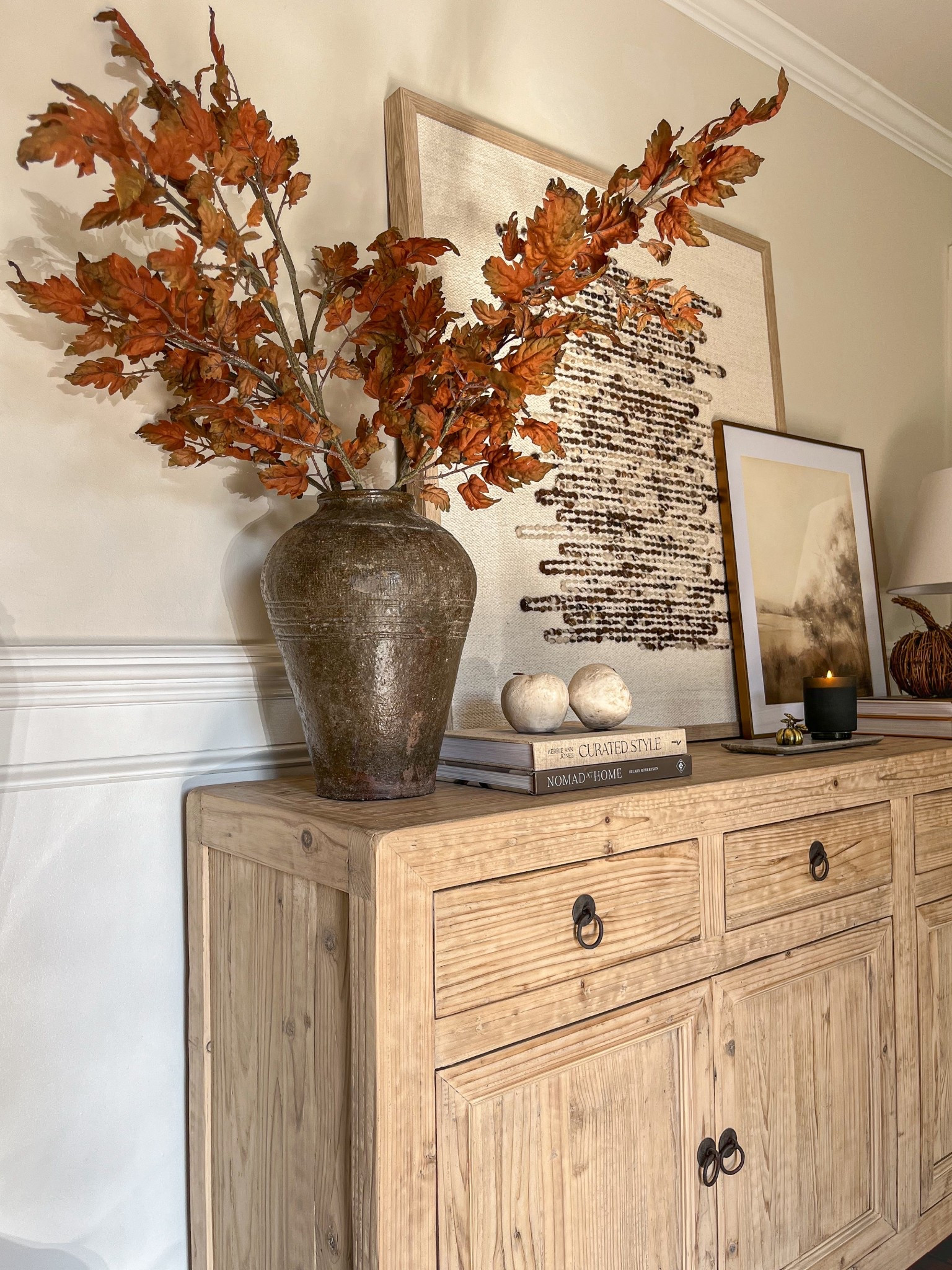 Autumn’s charm, styled in layers 🍂🍁🍎

|Fall Sideboard Styling| Mijiu Vessel|   |Magnolia Oak Leaf Stems| |Paper Mache Apples| |Layered Art| |Green Candle|

#LTKSeasonal #LTKHome #LTKStyleTip