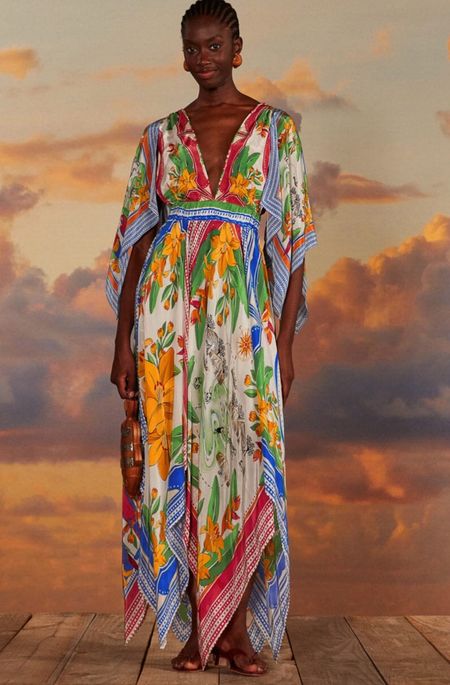 Farm Rio
Off-White Tropical Destination Kimono Sleeve Midi Dress

Embrace the vibrant essence of tropical escapades with the Off-White Tropical Destination Kimono Sleeve Midi Dress. This piece captivates with its kaleidoscope of lush florals and geometric prints, adorning an airy off-white canvas. The flowing kimono sleeves and cinched waist create an effortlessly elegant silhouette, perfected by a plunging V neckline that frames your natural beauty. A celebration of color and comfort, this dress is a getaway must-have that resonates with the joyous spirit of adventure

#LTKParties #LTKStyleTip