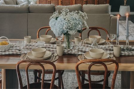 Dining room open concept. Live edge table with bentwood chairs. My chairs are antique but I linked some beautiful colored ones 😍 recreate this spring tablescape with this gingham tablecloth, dishware, and similar glass coupes and decor  

#LTKSeasonal #LTKFamily #LTKHome