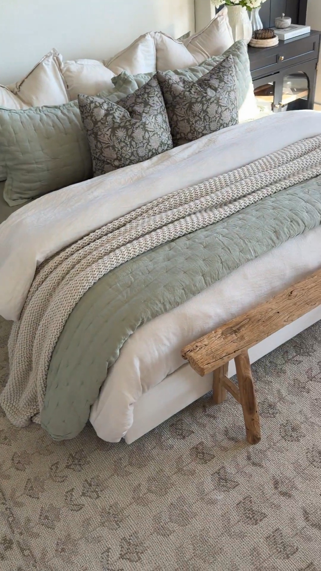 This bedroom refresh really started from the ground up with the Mabel rug in 9x12 — the perfect large neutral area rug to anchor a king bed and warm up light wood floors. The subtle pattern adds texture without overpowering the space and gives that modern organic, lived-in feel.

Our upholstered bed, black nightstands, and wood bench are from @Wayfair and create that timeless mix of contrast and warmth. I layered in soft, breathable bedding from @onequince for that relaxed, hotel-inspired finish — crisp organic sheets, linen duvet, and textured quilt for depth.

9x12 bedroom rug, Mabel rug, neutral area rug, large bedroom rug, modern organic bedroom, Wayfair upholstered bed, black nightstands, wood bench at foot of bed, bedroom furniture ideas, layered bedding look, linen duvet cover, organic cotton sheets, cozy master bedroom decor, warm neutral home 

#LTKHome #LTKSaleAlert #LTKSeasonal