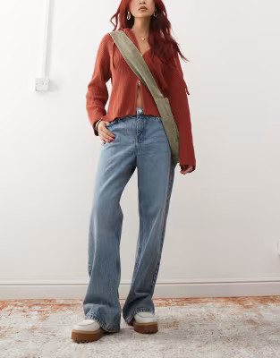 Monki Naoki low rise loose fit jeans in mid blue wash | ASOS | ASOS (Global)