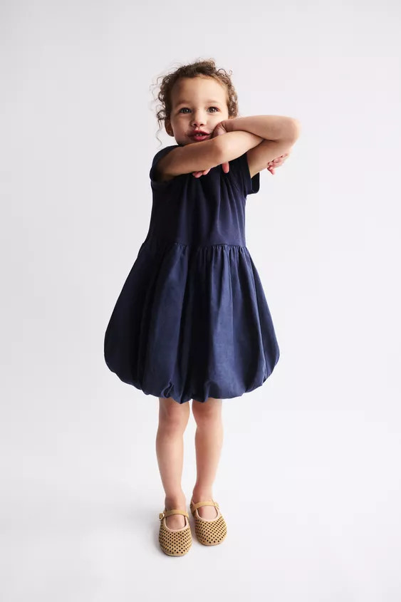 Dress with combined fabric, round neck and short sleeves. Balloon skirt. | Zara US
