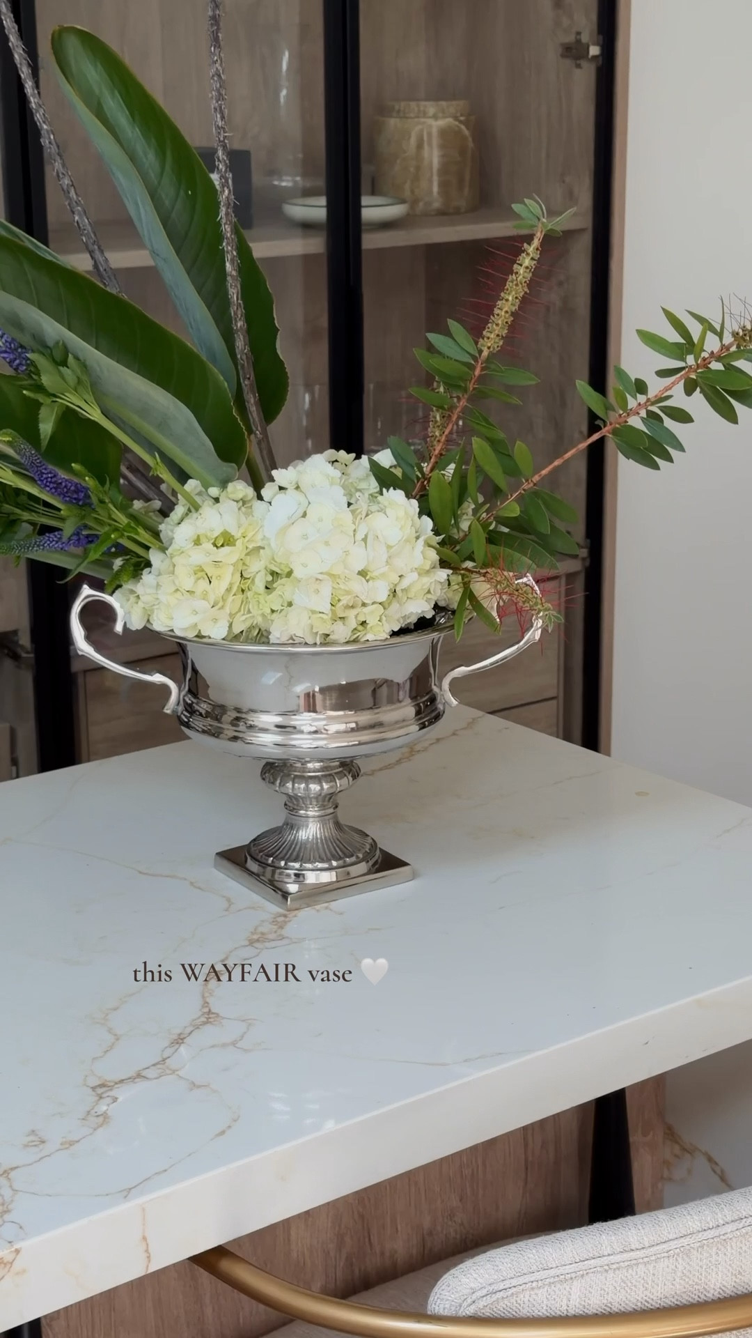 really into chrome home decor lately 🤤 decided to do a diy floral arrangement yesterday and love how it turned out. 
size 8.25” x 13.5” x 10” 

#MothersDay 
Linking lots of my favorite vases

Spring home
Silver vase 
Chrome vase 
Hand blown vase 
Ceramic vase 
Bud vase 
Glass vase 
Gifts for her 
Home decor 
Wayfair finds 
Mother’s Day gift 
WayDay 
Wayfair find 
Wayfair sale 

#LTKHome #LTKdayinmylife #LTKMothersDay