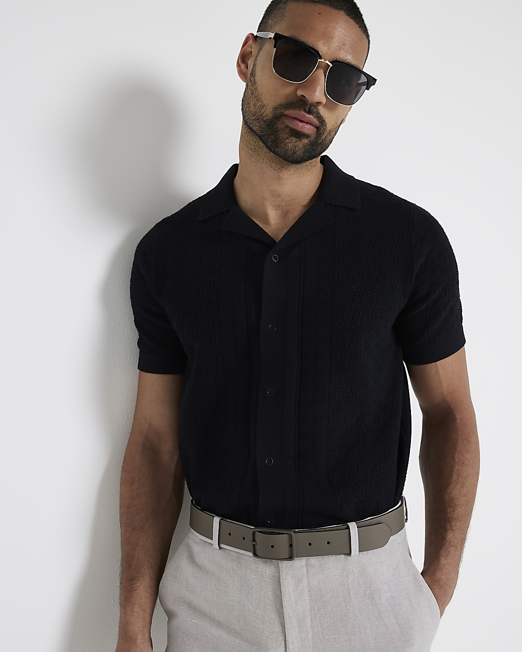 Black slim fit knitted polo shirt | River Island (UK & IE)