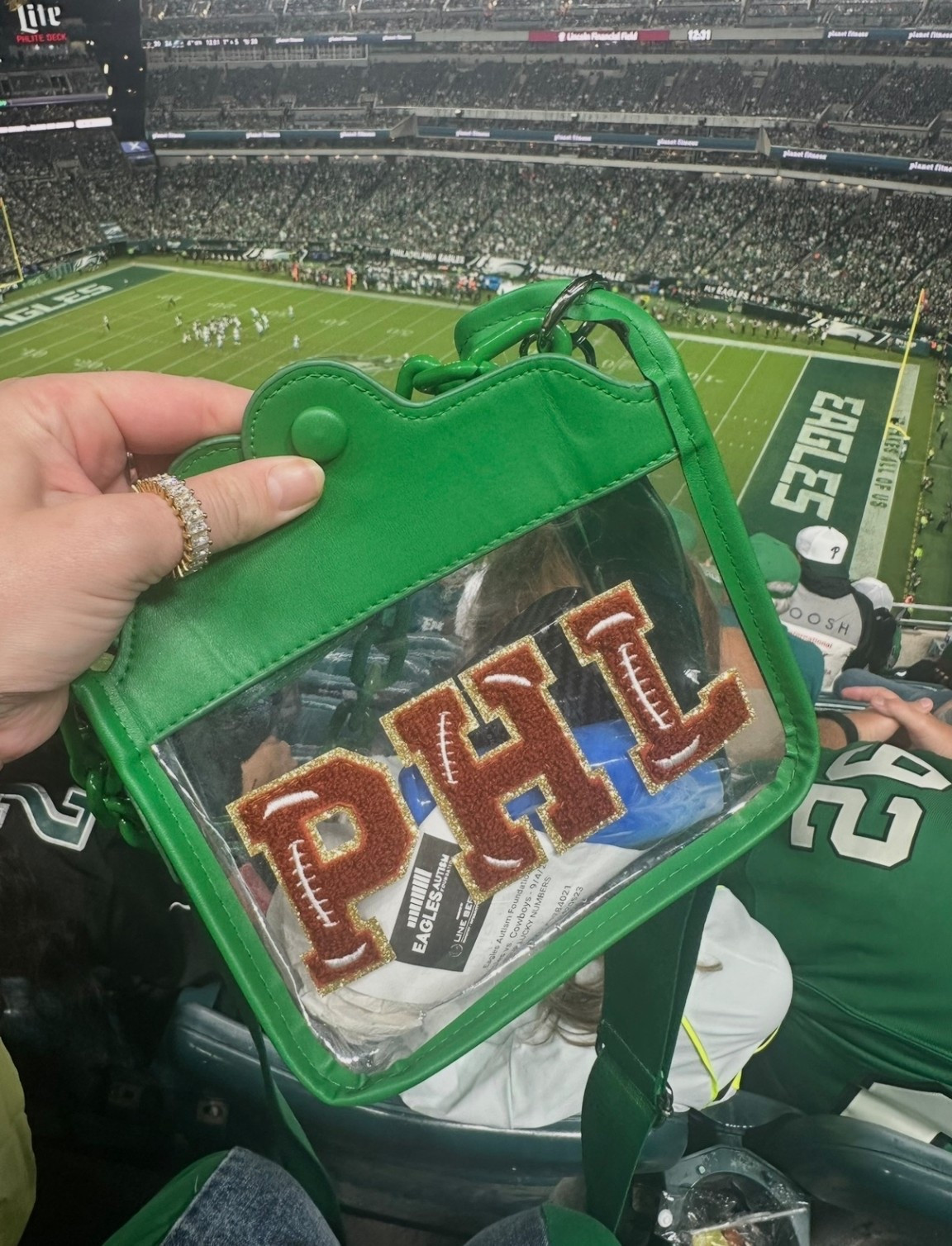Stadium approved bags - but make them as stylish as possible 🦅 🏈 
Featuring my budget-friendly gold emerald-cut eternity band ring 💎 

Obsessed with Phannies on Etsy. 
Bonus - shipping is always great! 
HOW ABOUT TONIGHTS WIN?

I have a Phillies stadium approved bag from their shop too I’ll share soon ⚾️ 
(Check them out for all your sports bags needs!)

#LTKWomens #ForGirls #ForHer #PhiladelphiaSports #Philadelphia #NFL #StadiumApprovedBag #PhiladelphiaEagles #Philly #EaglesMerch #Football #GirlsWhoLoveFootball #BudgetFriendly #EmeraldCut #EternityBandRing

#LTKSeasonal #LTKActive #LTKFindsUnder50