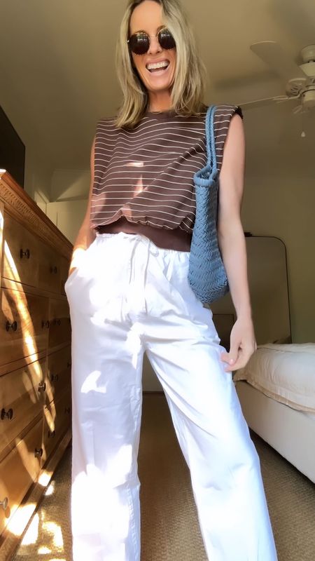 TGIF outfit 🤎 size small top ( so cute and love the shape ) … size small cotton pants ( the best non linen pull on pant I have tried! ) and a classic Birkenstock + pop of color bag. 

#LTKStyleTip #LTKVideo #LTKFindsUnder50