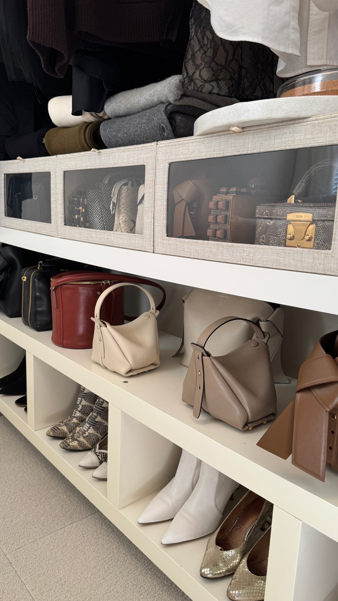 love these drop front boxes. they're sold as sweater boxes but they're perfect for keeping small bags in sight but free from dust, roomy enough to have extra storage in the back and giving my an additional shelf to put sweaters on top.

#LTKStyleTip #LTKSeasonal