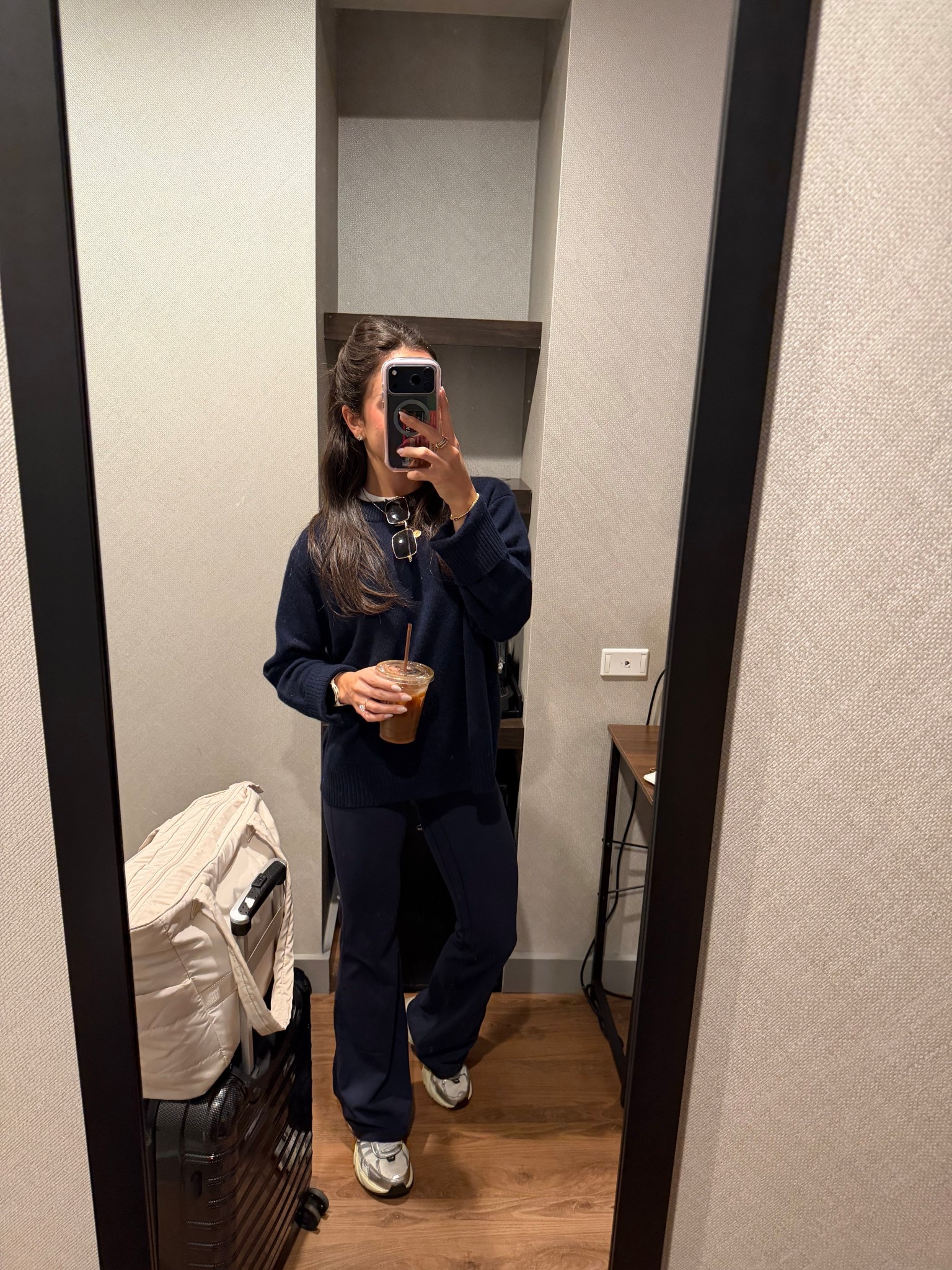 Easy casual travel airport outfit! Wearing my quince cashmere sweater and flared crz yoga pants for a comfy winter outfit. 

#LTKSeasonal #LTKFindsUnder100 #LTKootd