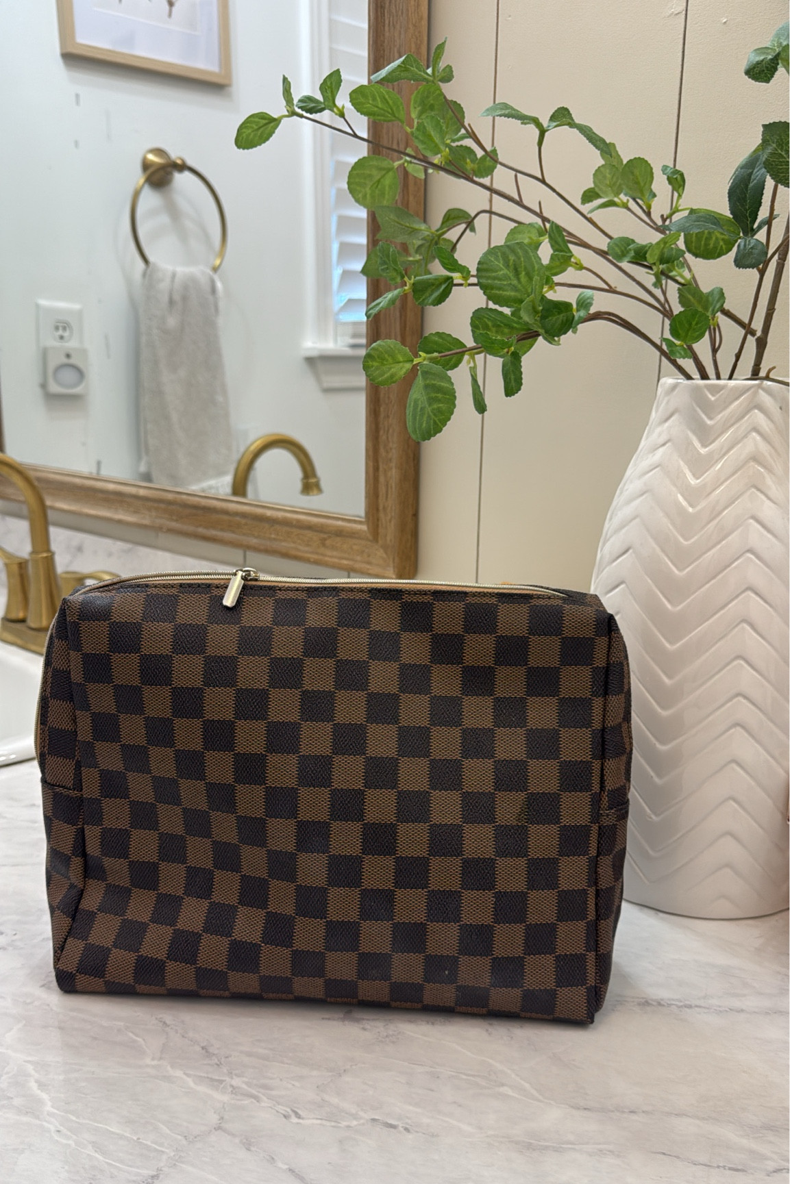 My makeup bag
I love the checker pattern, gold zipper detail and red interior 

It’s a great size that holds a lot! 

#LTKBeauty #LTKOver40 #LTKFindsUnder50