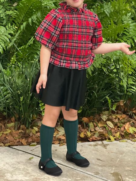 Holiday kids outfit with Christmas plaid / tartan and faux leather skirt. Complete the look with these affordable Mary Janes with a Pearl closure. Too cute 🎄

#LTKkids #LTKHoliday