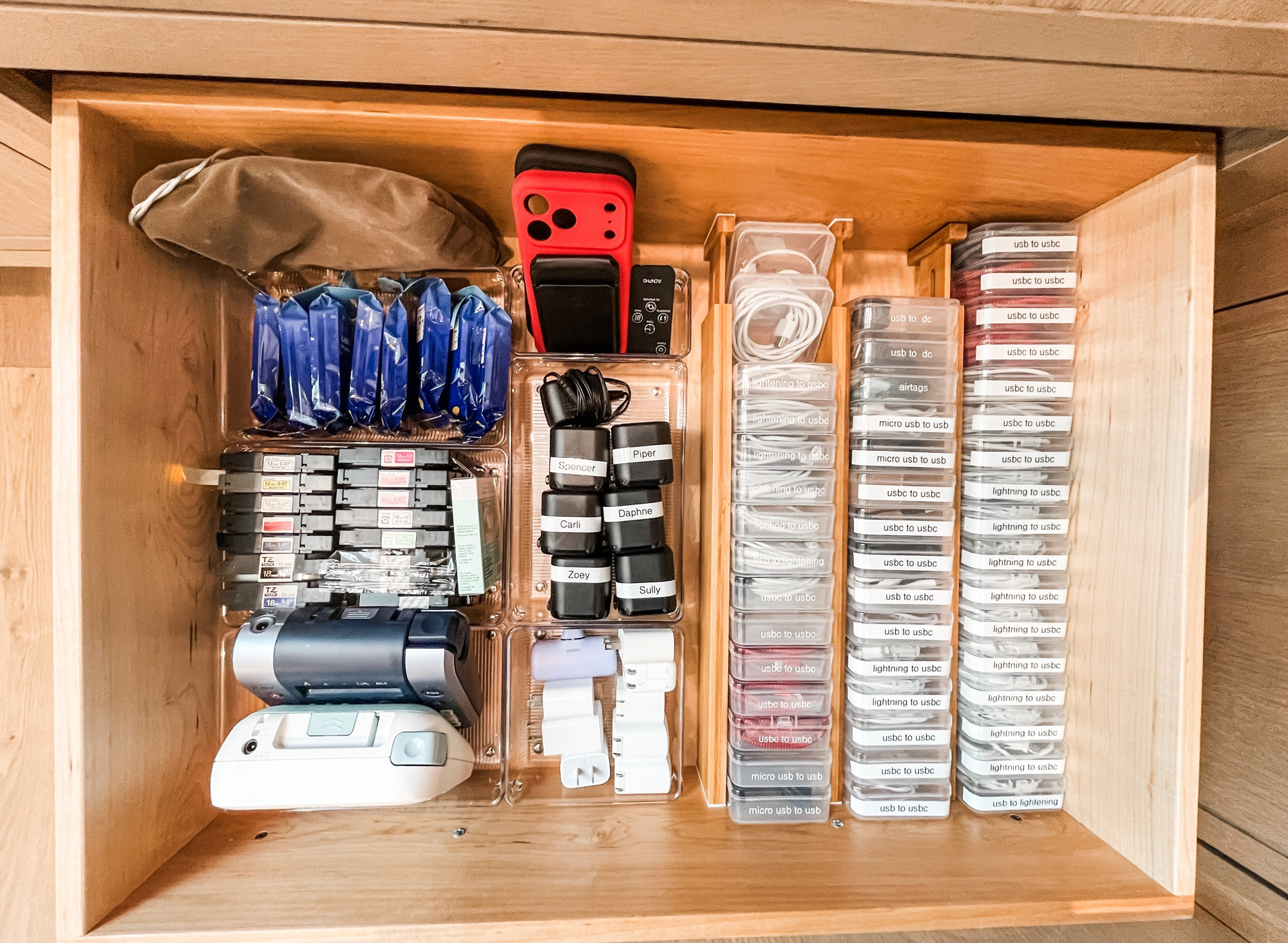 When we say we love a good label, we aren't kidding. 😉 

One way to make absolutely sure that you don't end up with a tangled mess of charging cords is to store them individually. And one way to make absolutely sure that you don't end up grabbing a different type of cord than the one that you need is to label each one. We've also taken the liberty of labeling all of the charging blocks as well because anyone with kids will tell you that these literally grow legs. Labels take all the guesswork out of a drawer like this one and we are here for it! 

 