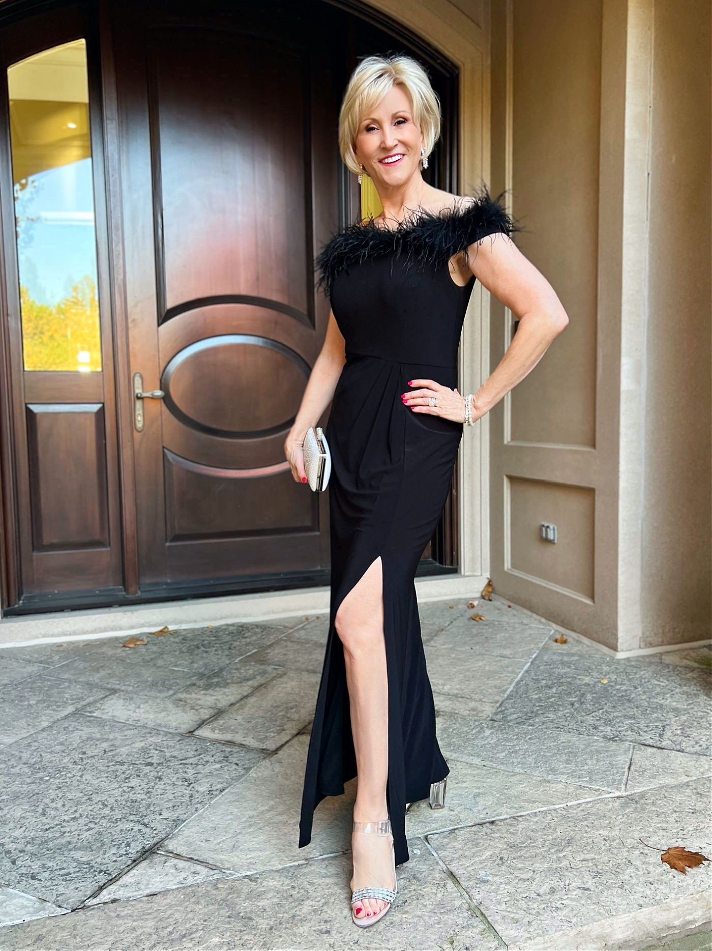 This one takes classic elegance to the next level with the beautiful feather details around the neck and shoulders. I love how that little touch of texture makes the dress feel so special while still keeping the timeless sophistication of an all-black look.

#LTKOver40 #LTKSeasonal #LTKWedding