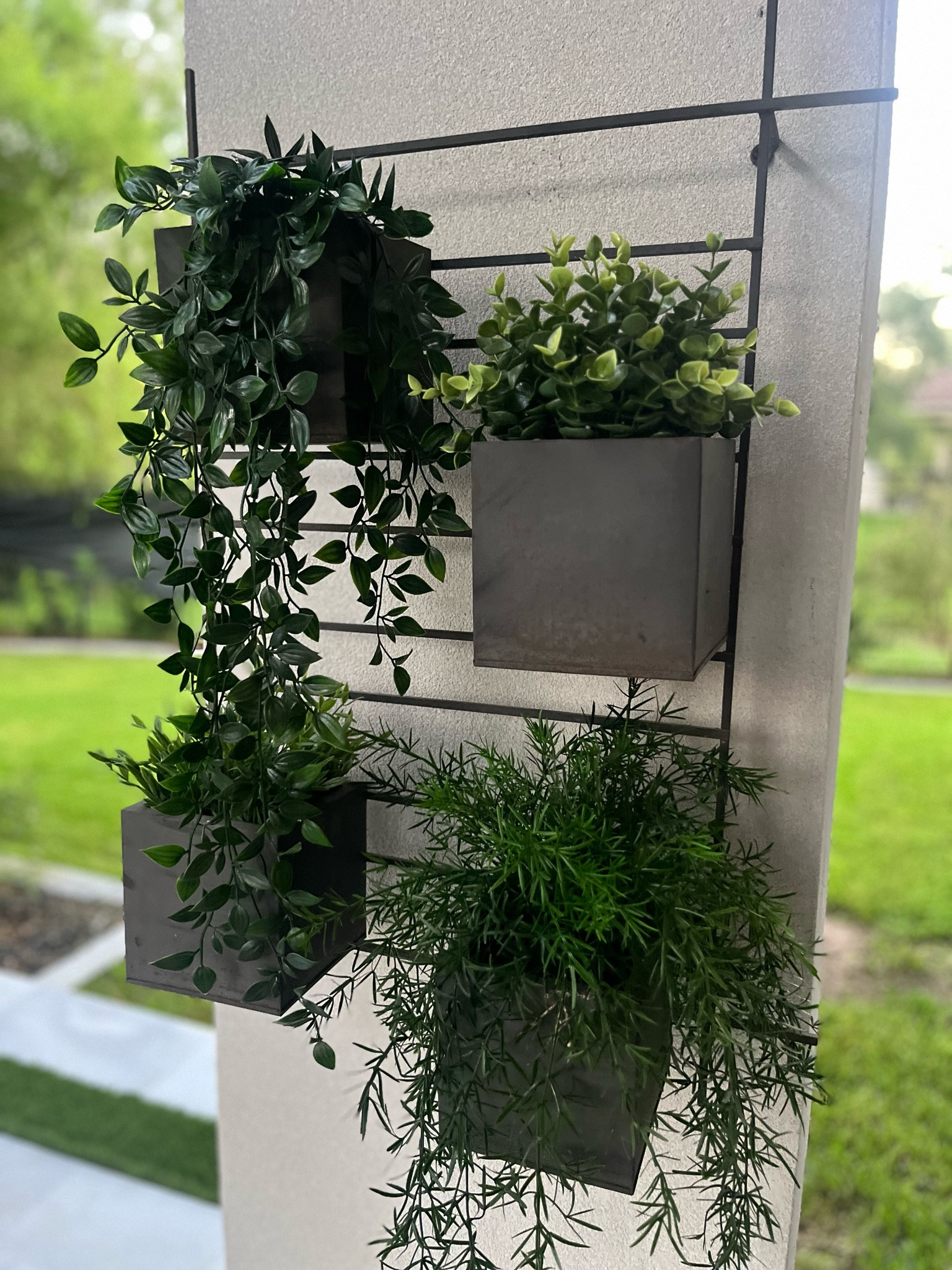 Outdoor wall planter, faux plants 

#LTKHome #LTKStyleTip #LTKFindsUnder50