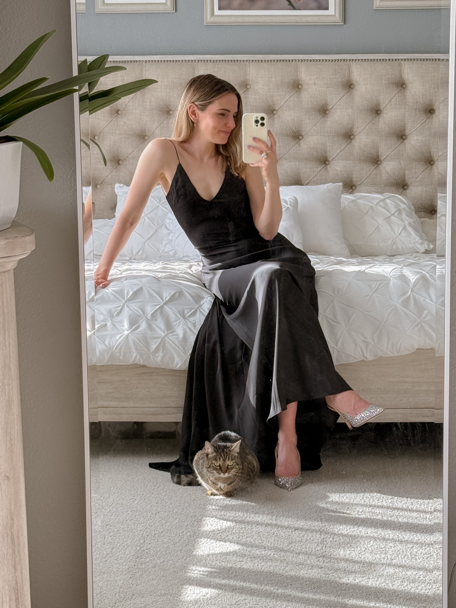 a classic never fails 🖤 i’ll always love a simple black slip dress moment - it’s  timeless, flattering, and effortlessly chic. I dressed it up with sparkly heels  (with chiki supervising, of course 😽).

wearing a size small in the dress. the dress drapes beautifully and feels like luxury, and the heels add the perfect little bit of glam ✨

#weddingguestdress #falloutfitideas #quietluxury #blackdress #slipdress 