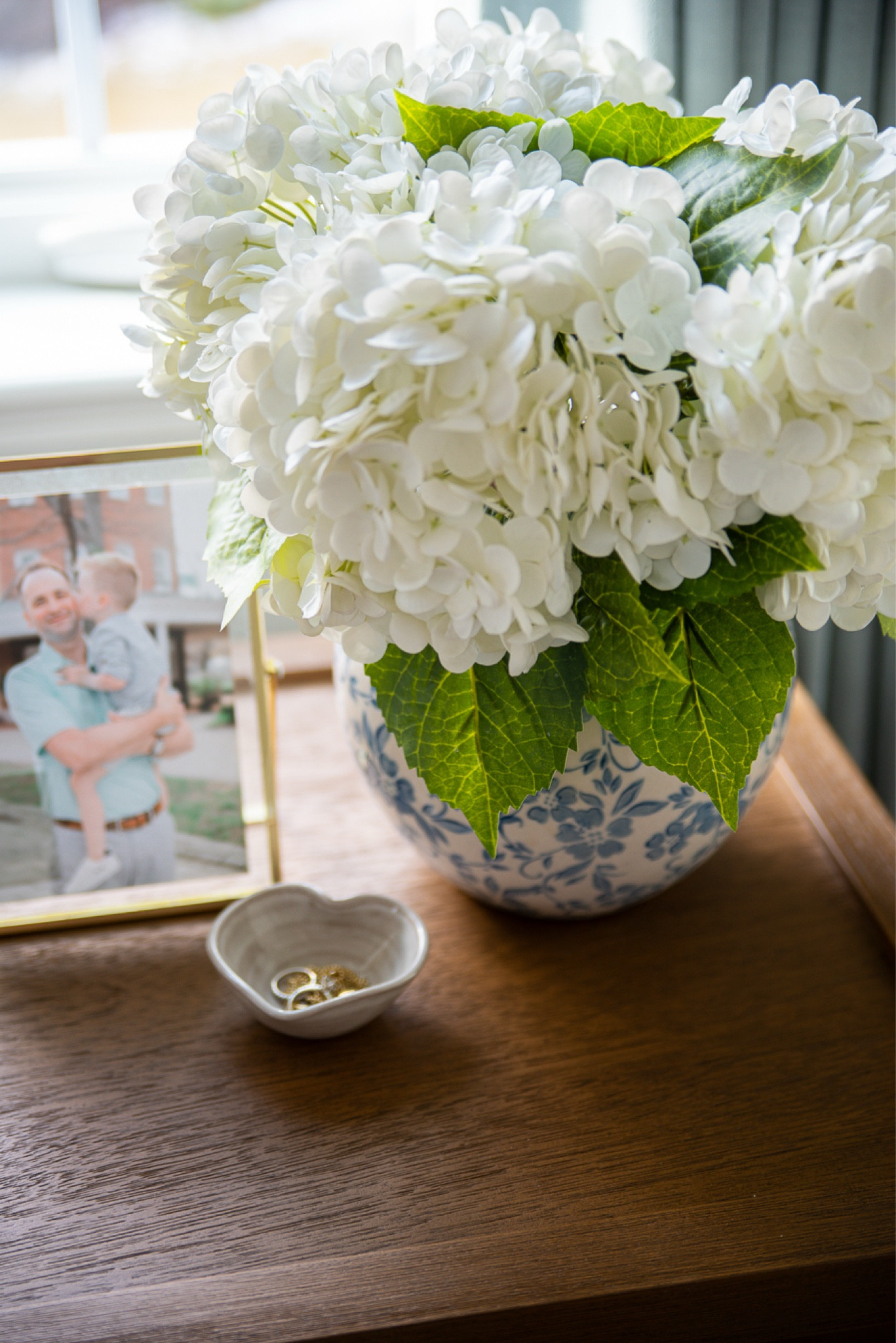 These faux hydrangeas are a staple in my home all year long! They are so stunning and realistic! I love with this blue and white vase in my bedroom! Both are from Amazon!

#LTKStyleTip #LTKHome #LTKFindsUnder50