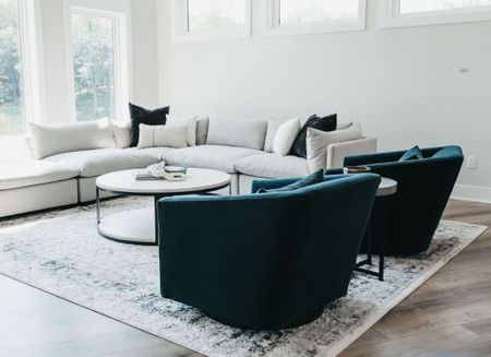 Laid back modern living room furniture with sectional, velvet swivel lounge chairs, throw pillows, area rug and more. 

#LTKhome