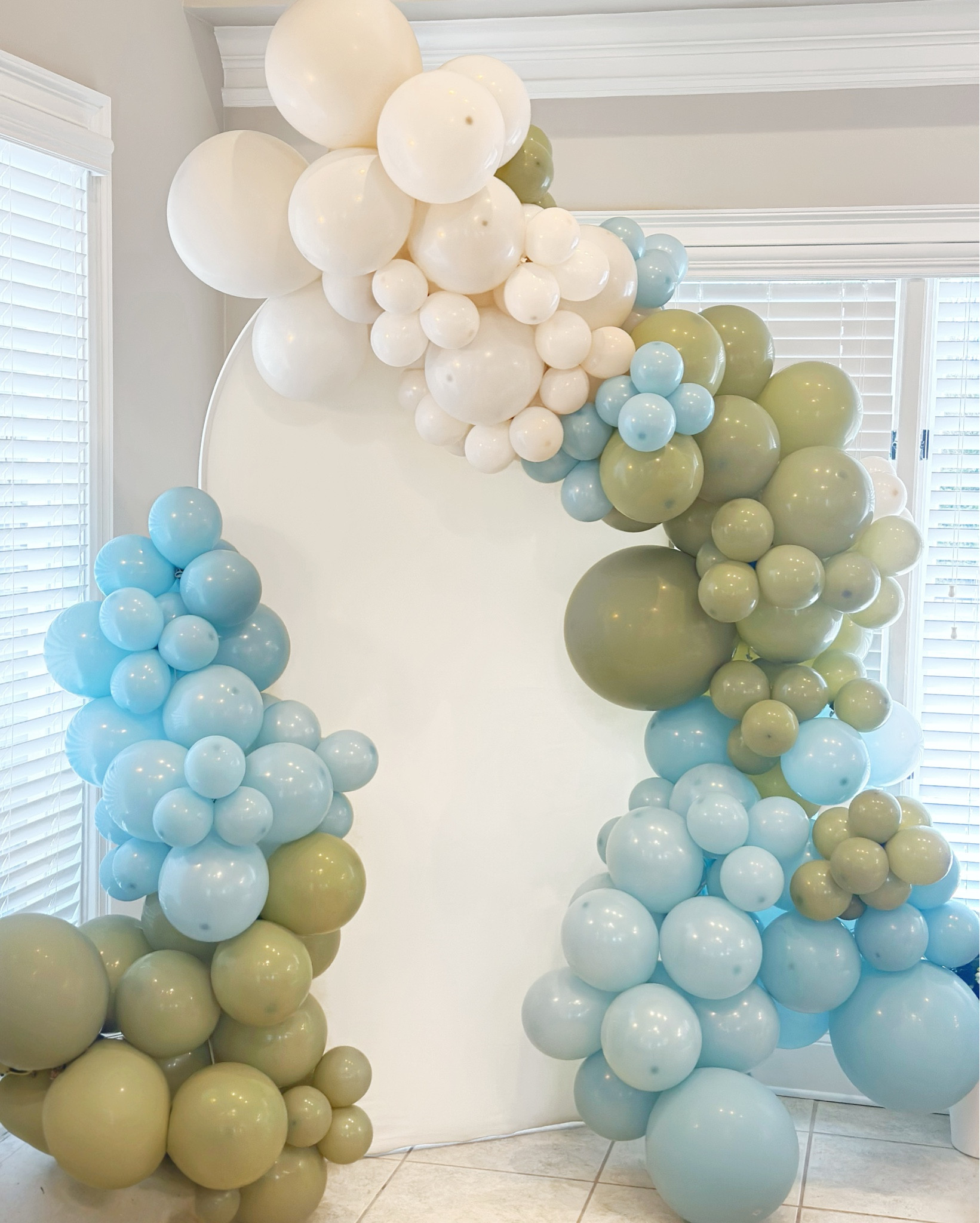 To complement the florals, Julie also designed a breathtaking balloon backdrop featuring a soft blend of green, blue, and cream-colored balloons. This playful display not only added a fun, vibrant element to the space but also provided the perfect photo opportunity for guests. The balloons seamlessly tied into the overall theme, balancing the elegance of the florals with a touch of celebration and whimsy.

https://southernhospitalityco.com/2025/03/14/showstopping-baby-shower-centerpiece/

#LTKBump #LTKBaby #LTKParties