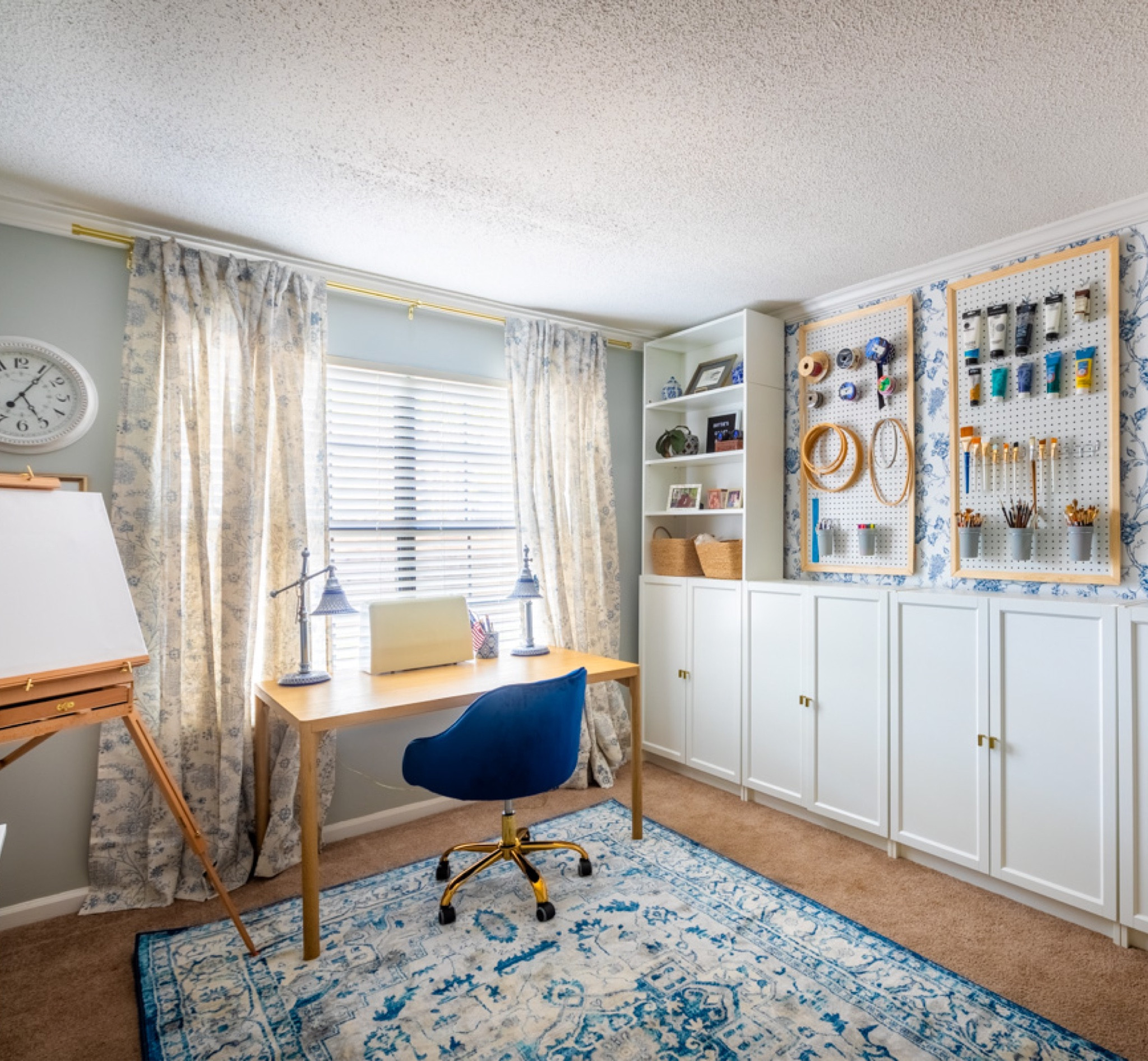 This art room design makeover incorporates Chinoiserie style wallpaper, customized storage solutions, and warm, homey touches, creating an inviting and organized environment for showcasing all art supplies. Shop my link to recreate this look #ArtRoomMakeover #ChinoiserieDecor #OrganizedArtSpace

#LTKstyletip #LTKhome #LTKfamily