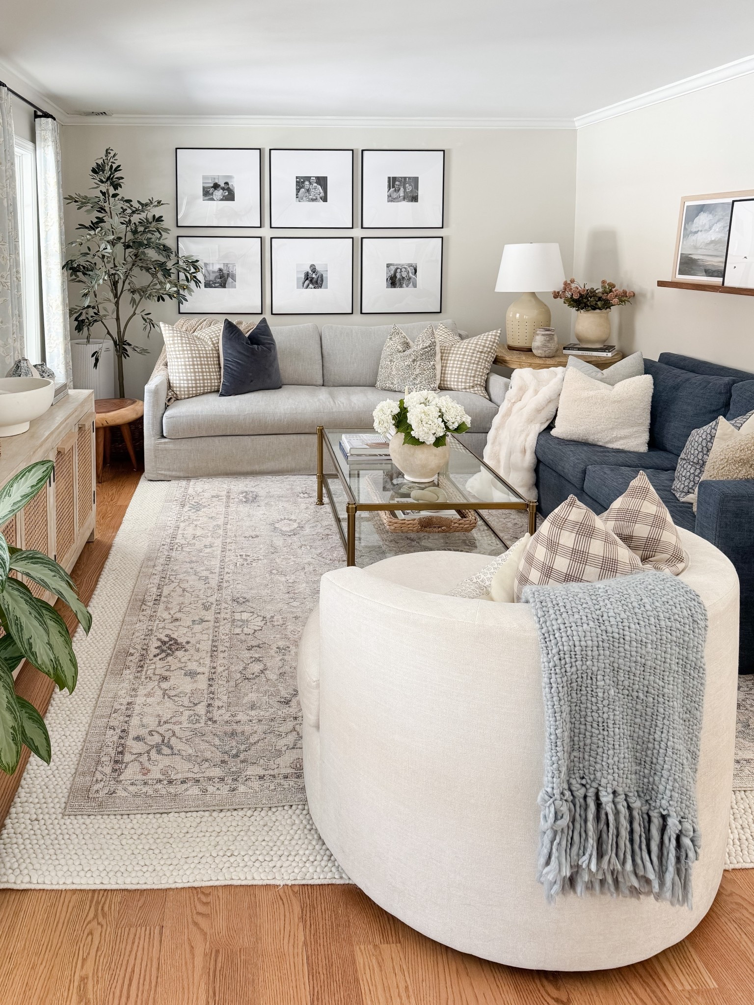 Coastal living room styled with neutral throw pillows, textured ivory rug, faux florals, and layered sofas for a relaxed high end coastal look.

coastal living room decor, neutral throw pillows, textured ivory rug, faux floral decor, layered living room styling, coastal home decor, neutral sofa styling, coffee table florals, light coastal interiors, sherricalnanhome

#LTKHome