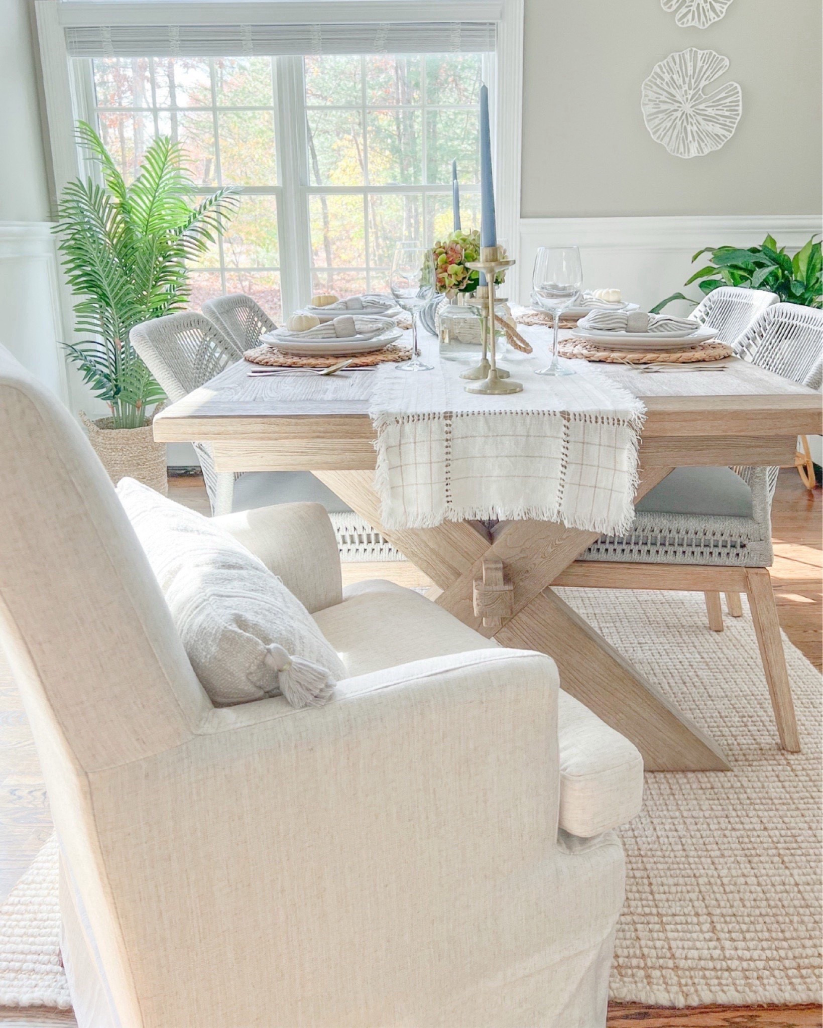 Our warm & cozy dining space! This table (in the seadrift finish) has been one of my favorite furniture purchases to date!
- 
home decor, decor under 50, home decor under $50, holiday decor, coastal decor, beach house decor, beach decor, beach style, coastal home, coastal home decor, coastal decorating, coastal house decor, home accessories decor, coastal accessories, beach style, neutral home decor, neutral home, natural home decor, thanksgiving tablescape, coastal dining room decor, neutral Thanksgiving tablescape, toscana dining room table, pottery barn dining room table, coastal dining table, dining chairs, rope dining chairs, side chairs, neutral table runner, blue candles, brass candlesticks, striped linen napkins, napkin rings, woven placemats, holiday tablescape, thanksgiving table decor, coastal farmhouse dining table, neutral dining room, target dining chairs, upholstered dining chairs


#LTKFindsUnder100 #LTKFindsUnder50 #LTKHome
