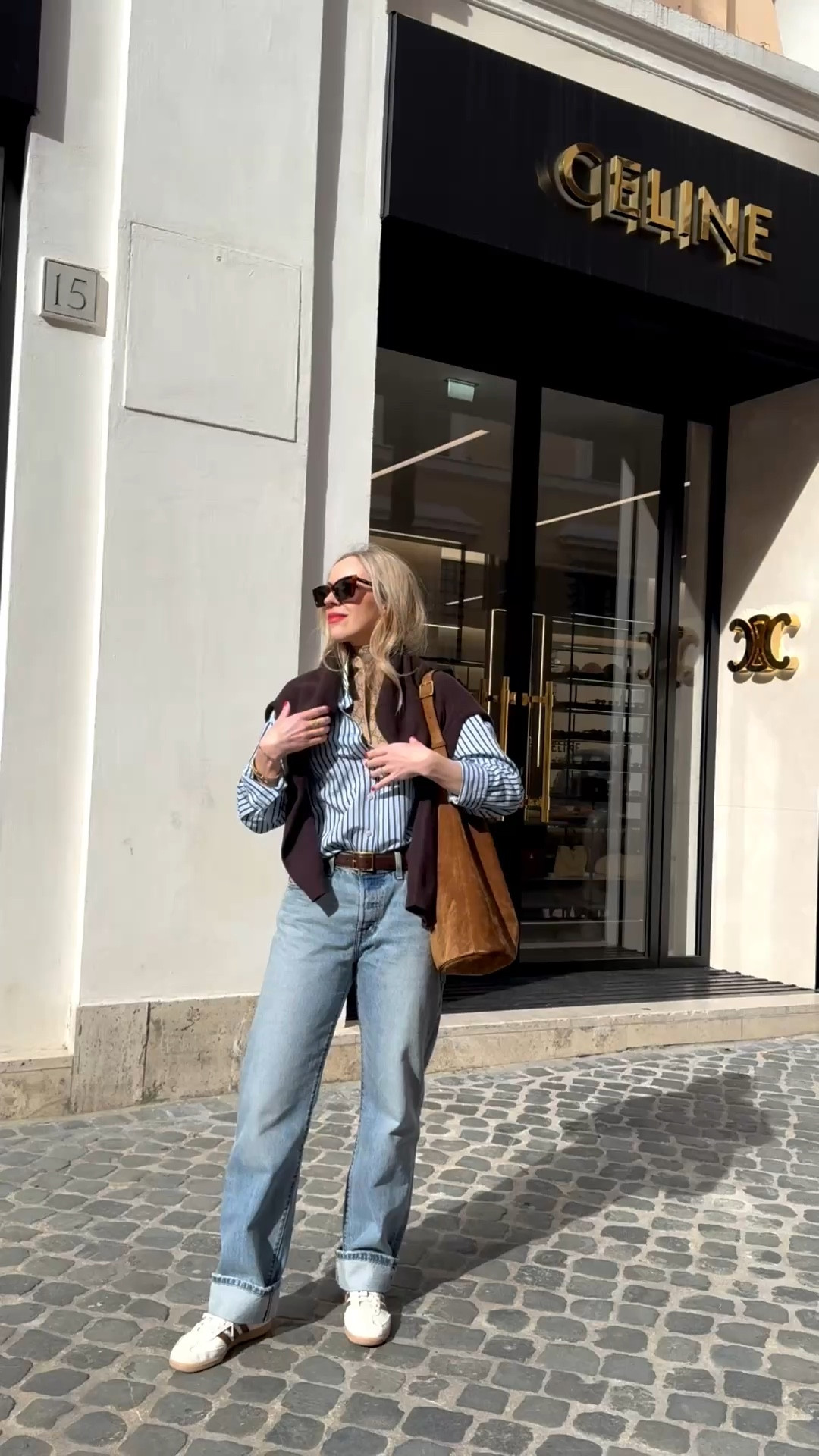 Travel look, European vacation, @Zara striped shirt, @Levi's baggy 90’s jeans, chocolate brown and baby blue, spring outfit, YSL suede bucket bag 

#LTKTravel #LTKOver40 #LTKSeasonal