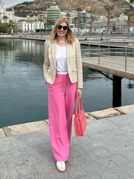 Travel outfit. Stylish, smart casual travel outfit. Over 40. Over 50. Pink wide leg trousers. Retro leather trainers. Feminine check jacket. Me + Em style  

#LTKtravel #LTKeurope #LTKSeasonal