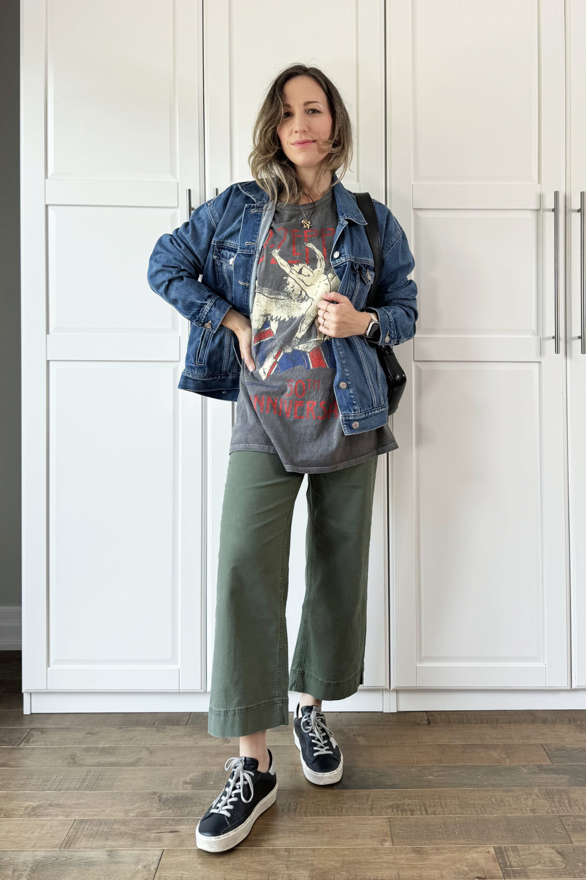 Olive green pants outfit for fall with graphic tee and denim jacket  