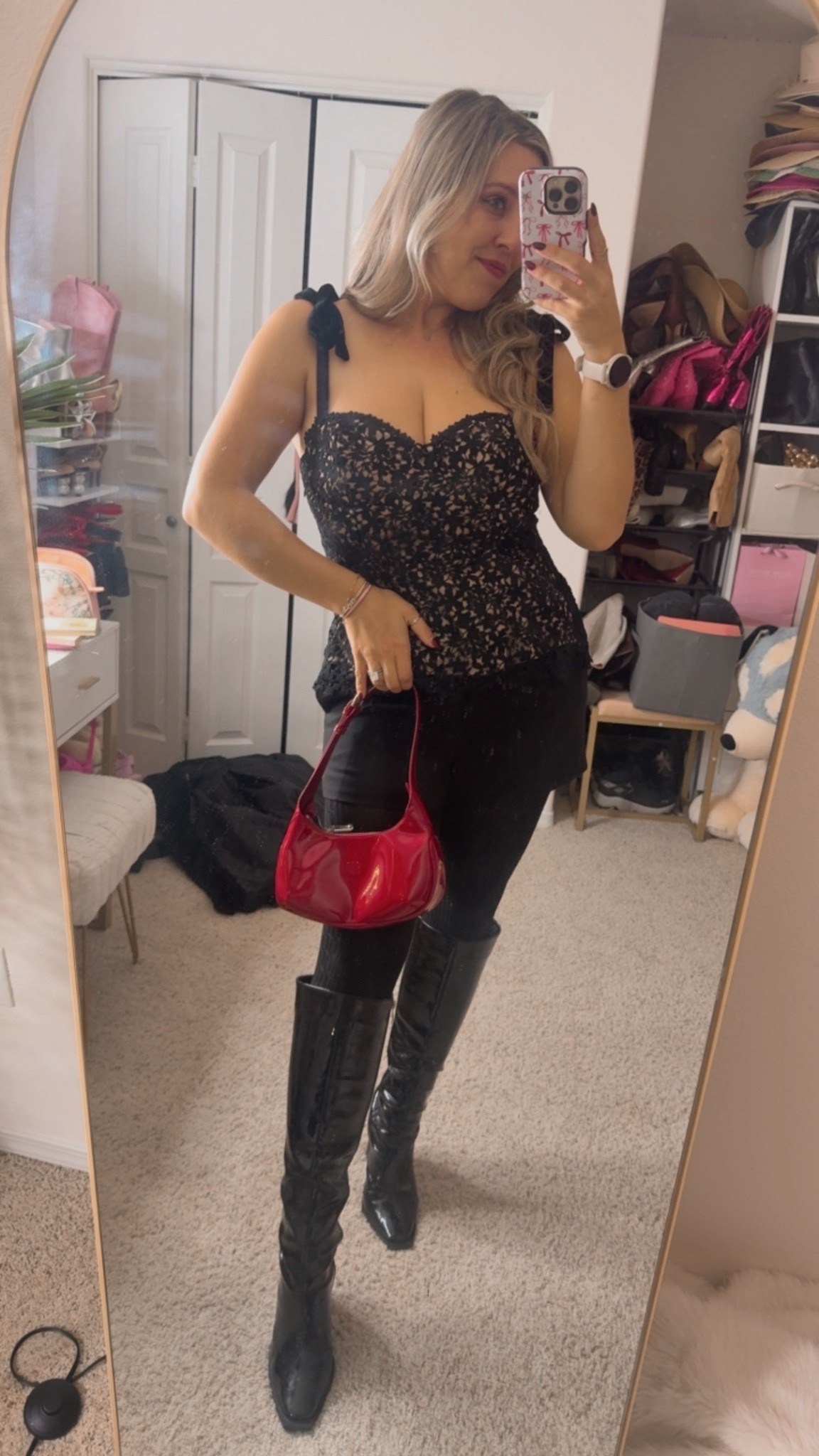 Black bustier top with velvet bow straps and corset tie back 

Black winter shorts
Red purse 

#LTKSeasonal #LTKootd #LTKHoliday