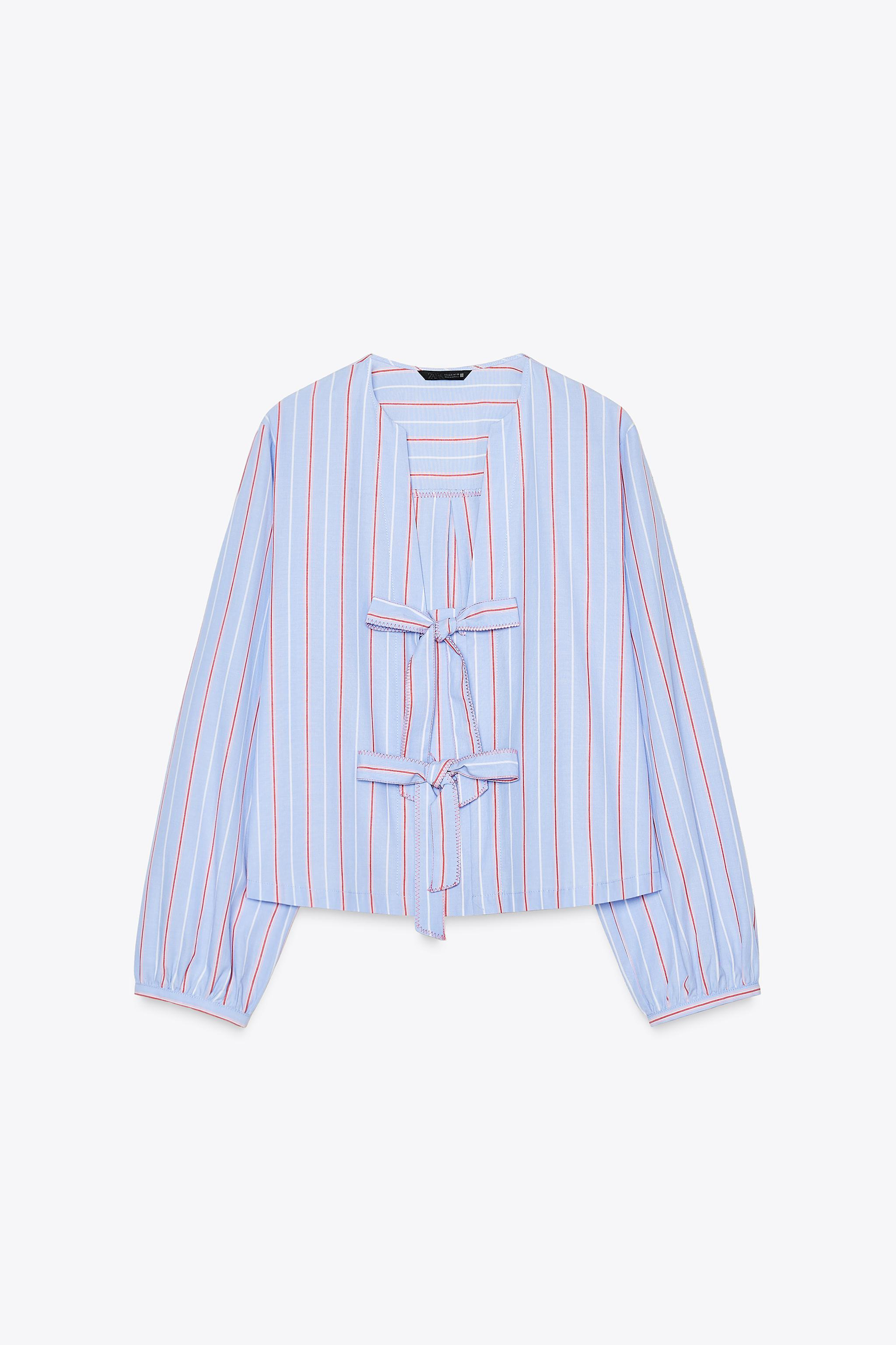 Camicia con collo rotondo e maniche lunghe. Chiusura frontale con lacci. | Zara IT