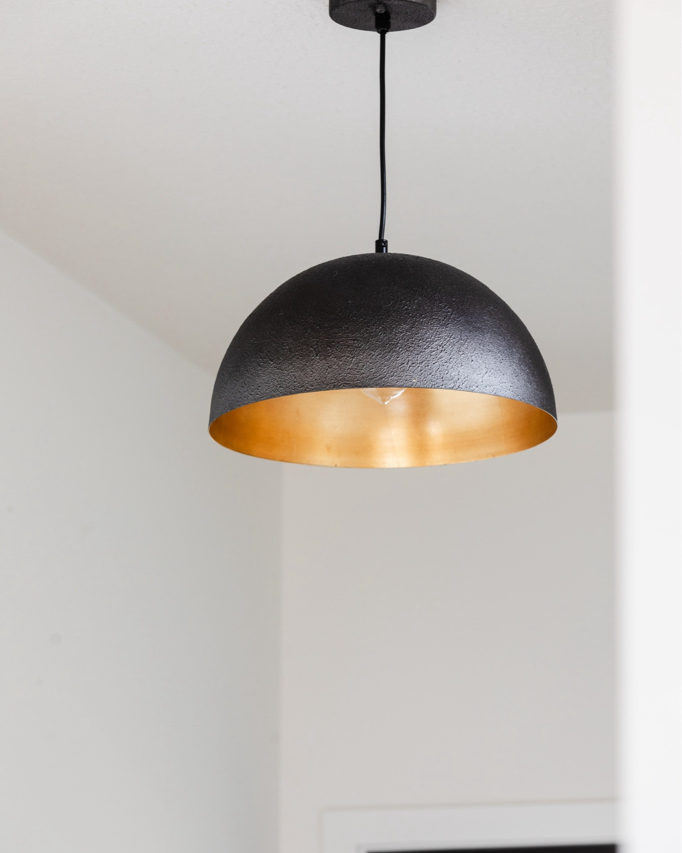 A dome pendant light, with brass and black, that is sure to make a statement. Perfect for an entryway, like shown here in our #IGHnewbuild project.

#LTKHome