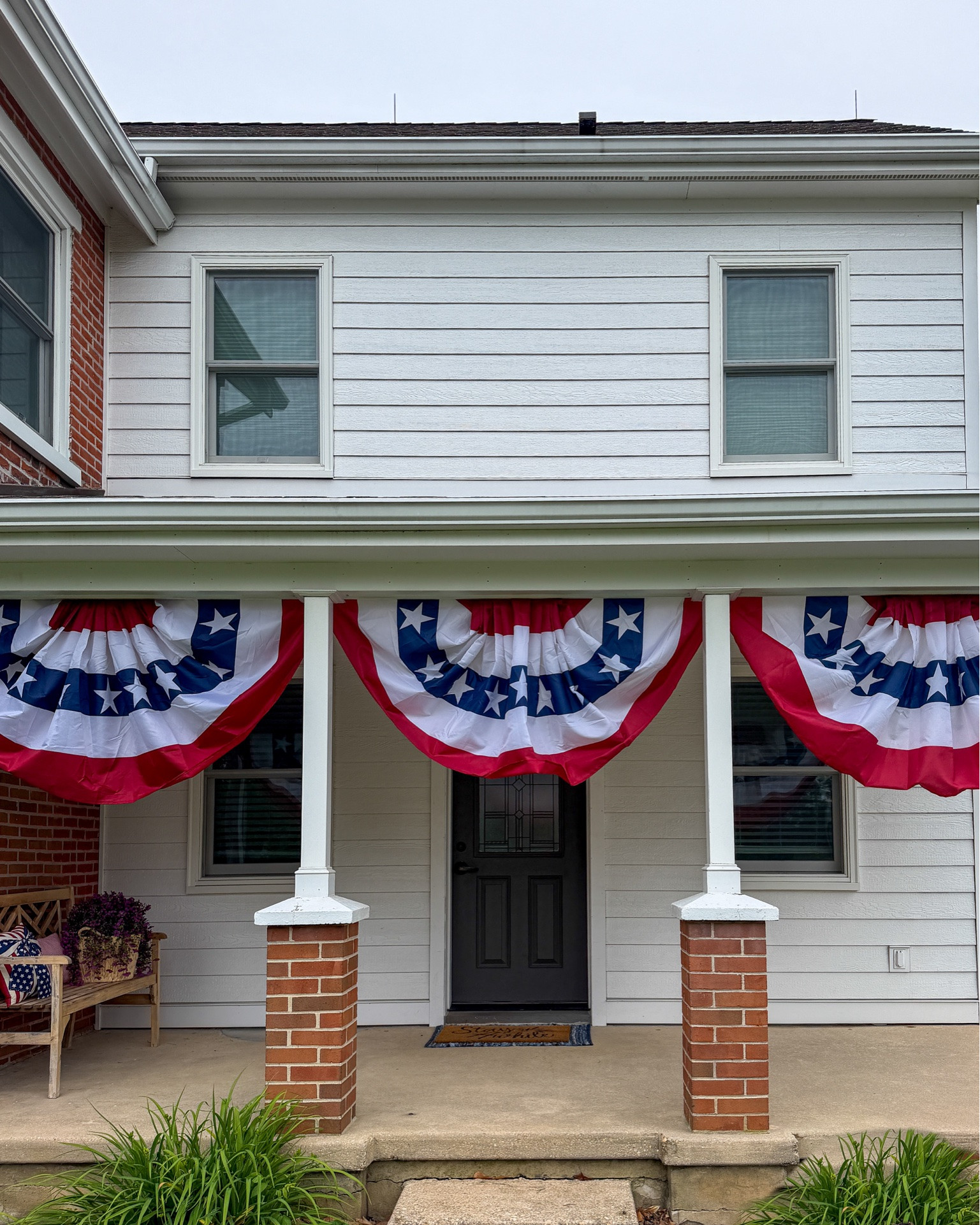 Love these American Flag Buntings. The perfect patriotic touch our porch needed 
for Memorial Day and 4th of July! 🇺🇸🎆

I ordered 2 sets of artificial flowers for a fuller look.

#LTKHome #LTKSeasonal