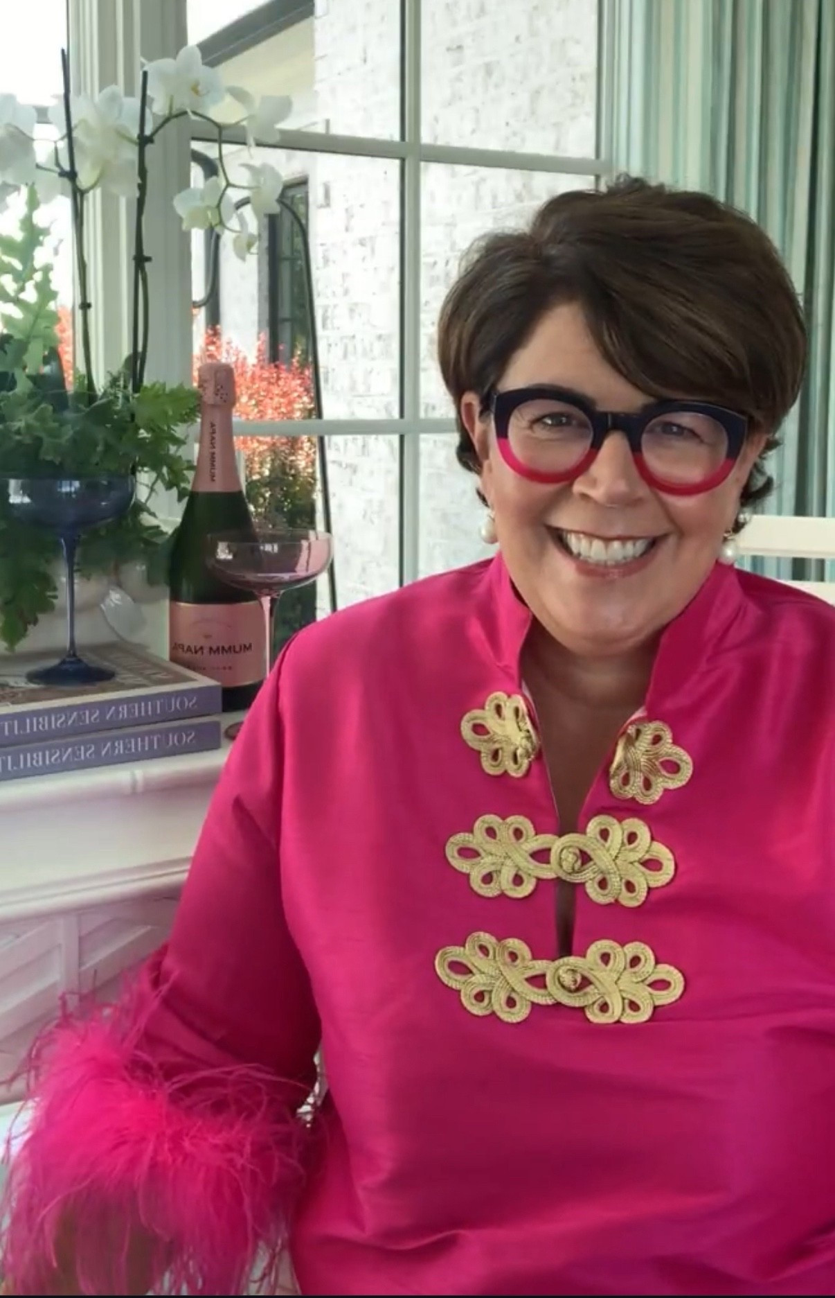 The fabulous hot pink dress with feather sleeves that I wore when I announced my new book, Southern Sensibility  
