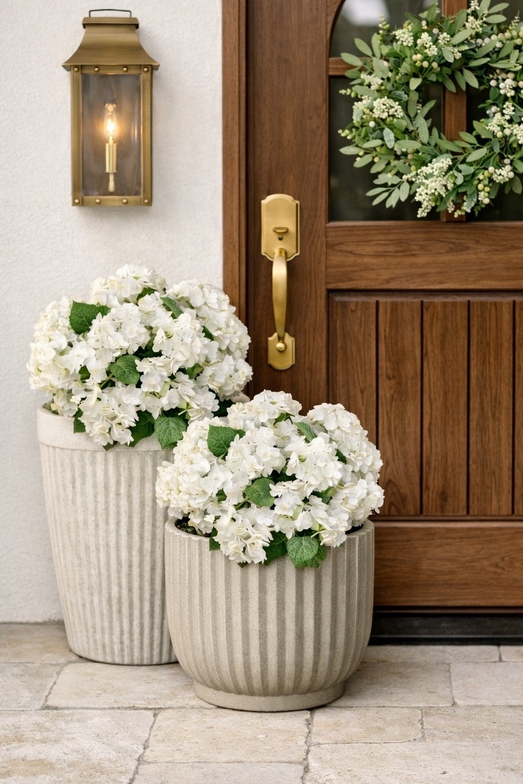 Spring inspired the front porch. Love these faux hydrangea bushes!￼

#LTKSaleAlert #LTKHome #LTKSeasonal