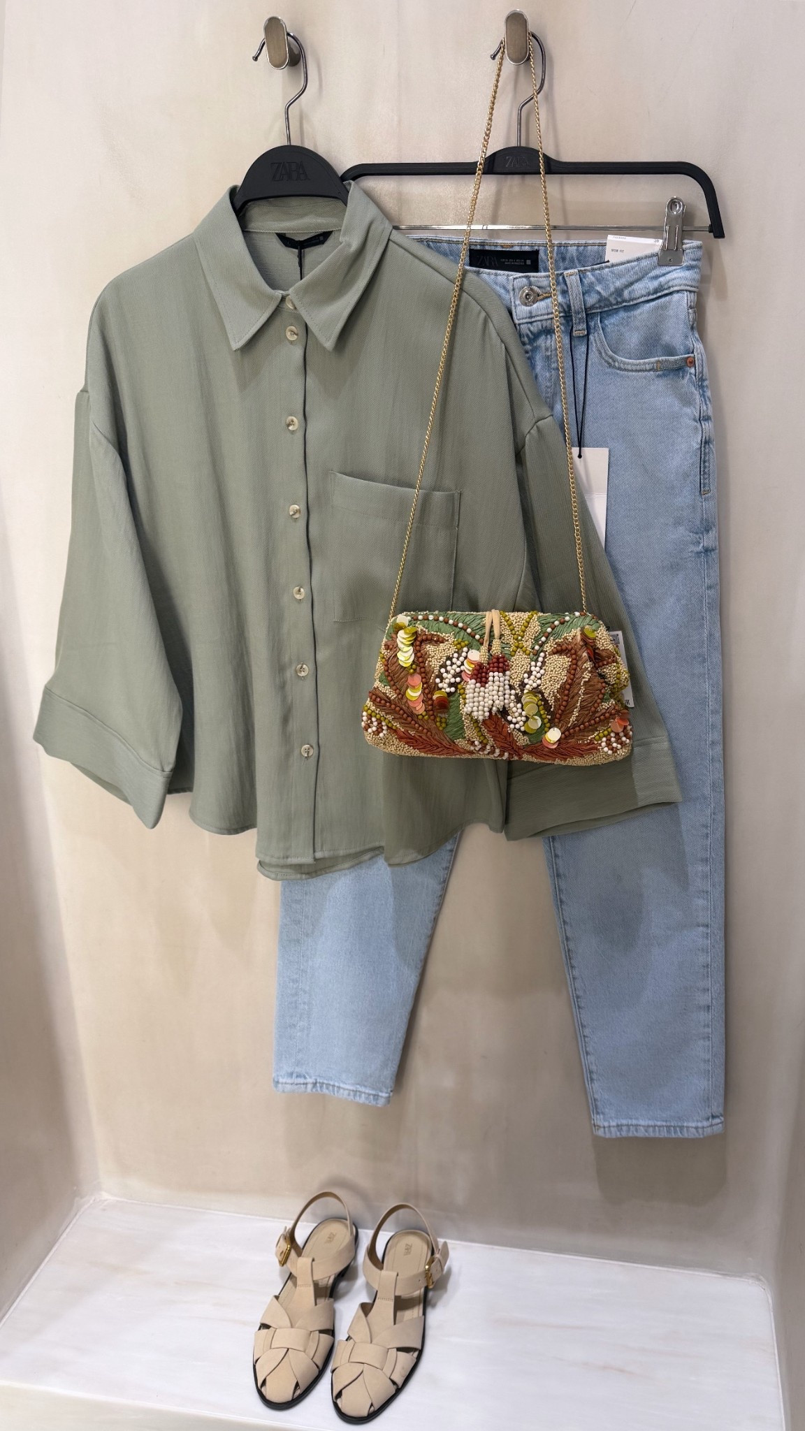 NEW IN ZARA❤️‍🔥
Tags: Sage green shirt olive spring colour trend mom fit jeans light wash high waist denim embellished clutch bag gold chain strap holiday vacation statement city break colorful cage sandals beige cream neutral flats mules fashion inspo outfit ideas elevated capsule wardrobe basics

#LTKootd #LTKspringtrends #LTKspring