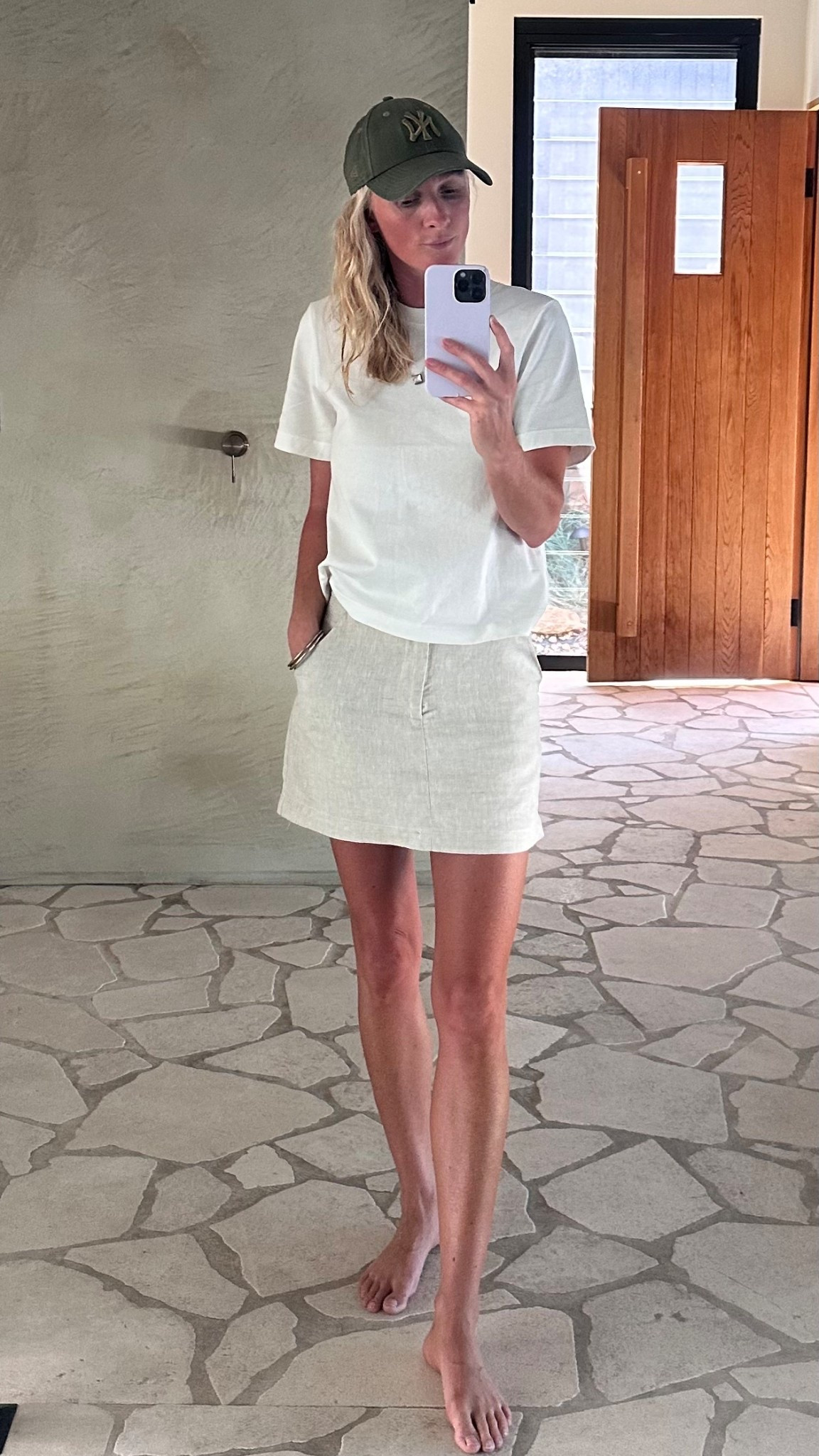 Linen mini paired with a classic white tee — one of my favourite effortless combos. I love this relaxed shape worn untucked for an easy, timeless look. 

#LTKaustralia #LTKnewzealand #LTKspring