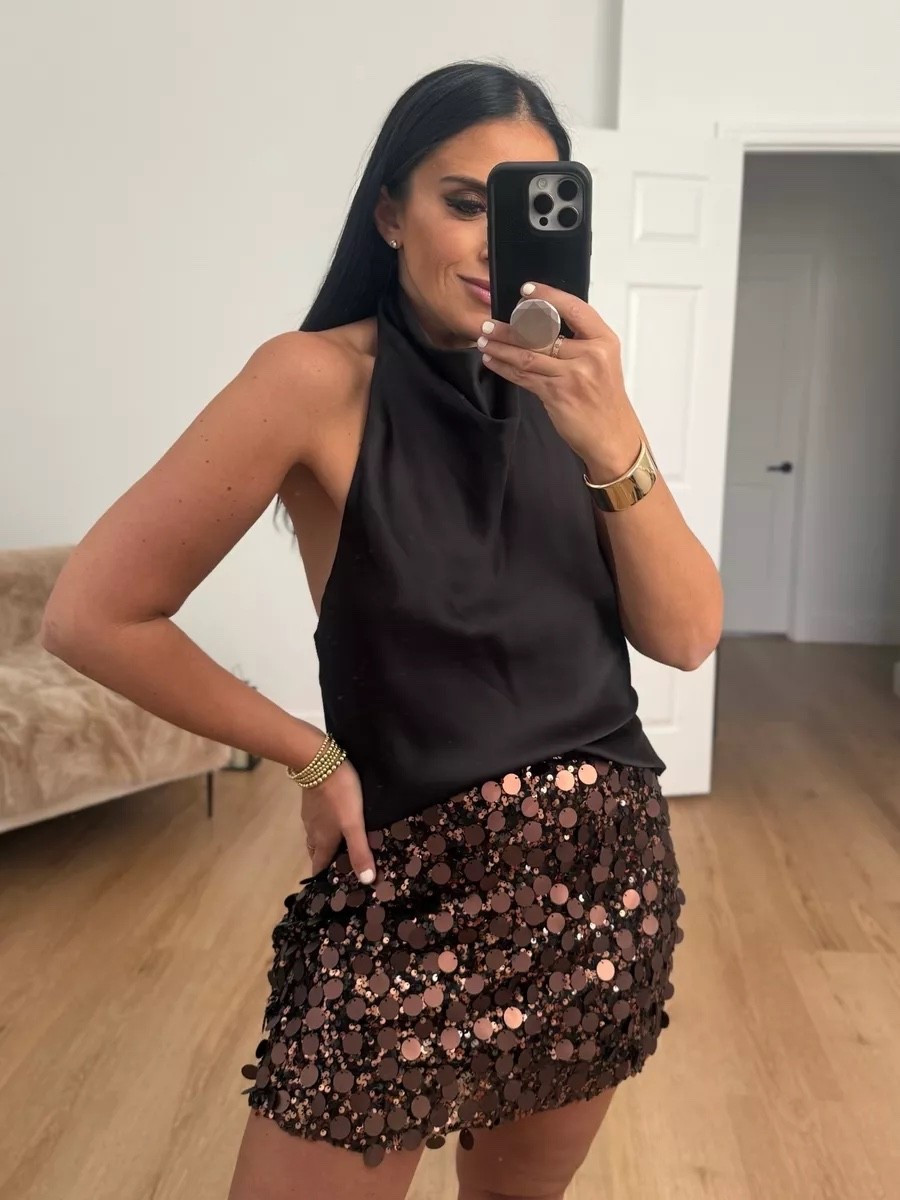 Satin effect halter top wearing size medium. Sequin mini skirt wearing size medium.

