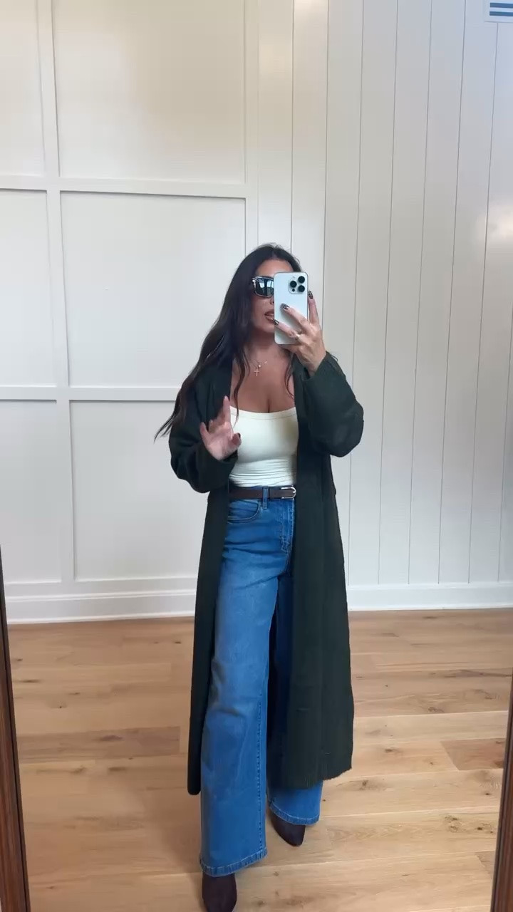 A long cardigan always makes a simple outfit look effortlessly chic! This deep-green cardigan layered over a white tank and jeans is the perfect easy fall outfit for errands, travel or a casual dinner. Tap to shop! 💚
#LongCardigan #FallOutfitIdeas #CasualStyle #MomFashion #LTKFinds