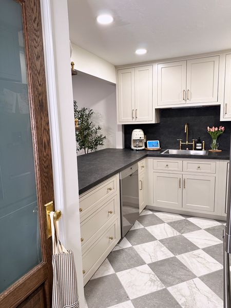 Small kitchen decor and finishes, brass kitchen sink, custom pantry door, gold door knobs, black countertops, cabinet handles and hardware, faux tulips, smell coffee maker, faux olive tree

#LTKhome #LTKsalealert