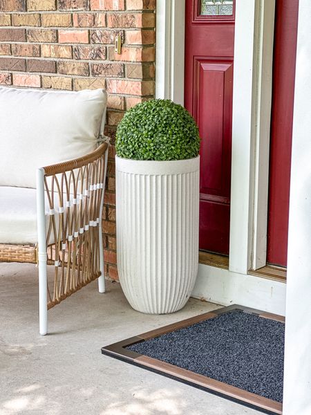 Front porch has never been easier to decorate than with a tall fluted planter, topiary ball I don’t have to water and comfy patio chairs!

#LTKhome #LTKunder100 #LTKSeasonal