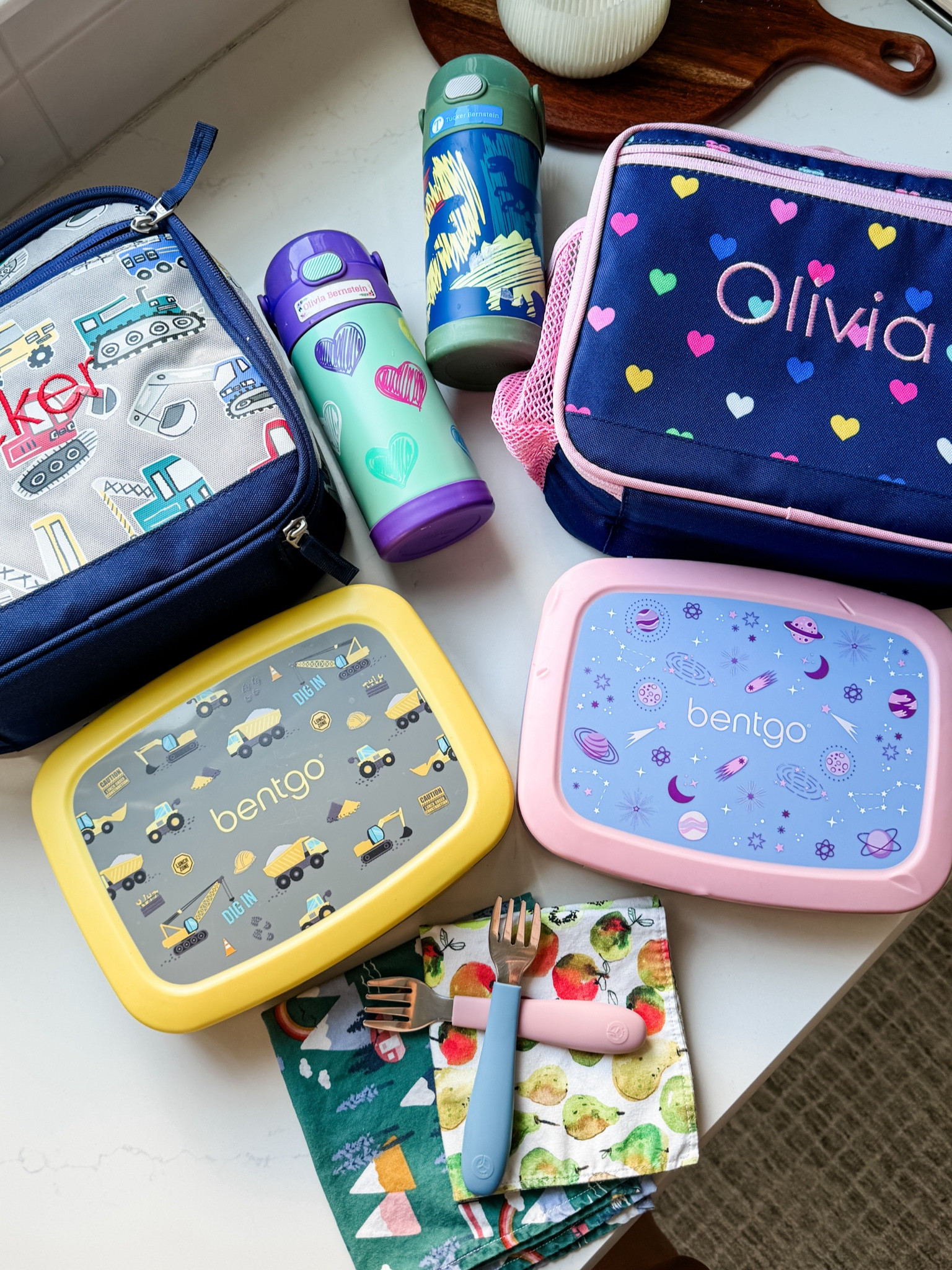 Lunch box supplies for Olivia and Tucker. The Bentgo bento lunch boxes are the perfect size for their age and easy to open. We really like the Thermos water bottles, the wee sprout utensils and I’m a big fan of sending cloth napkins. I got a custom pack on Amazon but my MIL also makes them for us. Oh and I use the Name Bubble stickers to label everything! 