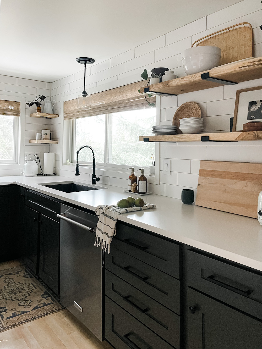 Still one of my very favorite kitchen remodels! Painted black cabinets, new quartz countertops, and open kitchen shelving makes such an impact. This space includes a lot of small updates to that can be done anywhere, including pendant, light woven, wood, shades, and corner shelves. 

#LTKHome