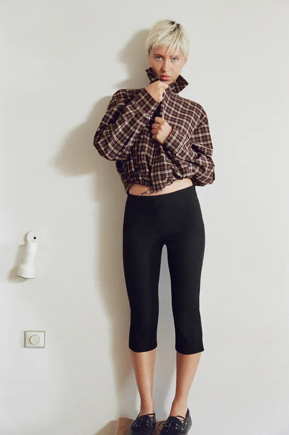 Jacket with a stand collar and long sleeves. Features welt pockets at the sides and an adjustable drawstring hem. Front zip fastening. | Zara US