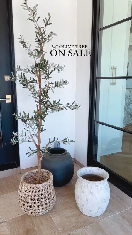 The best deal I've seen on this faux olive tree. I linked my favorite pots for it as well. 
