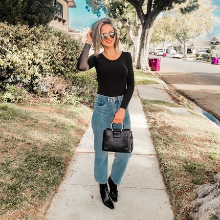 Love finding a classy yet statement leather bag! Simplicity is everything and this outfit shows it perfectly. While-leg jeans, simple black tee, black booties and a cute black bag. 

#LTKover40 #LTKstyletip #LTKitbag