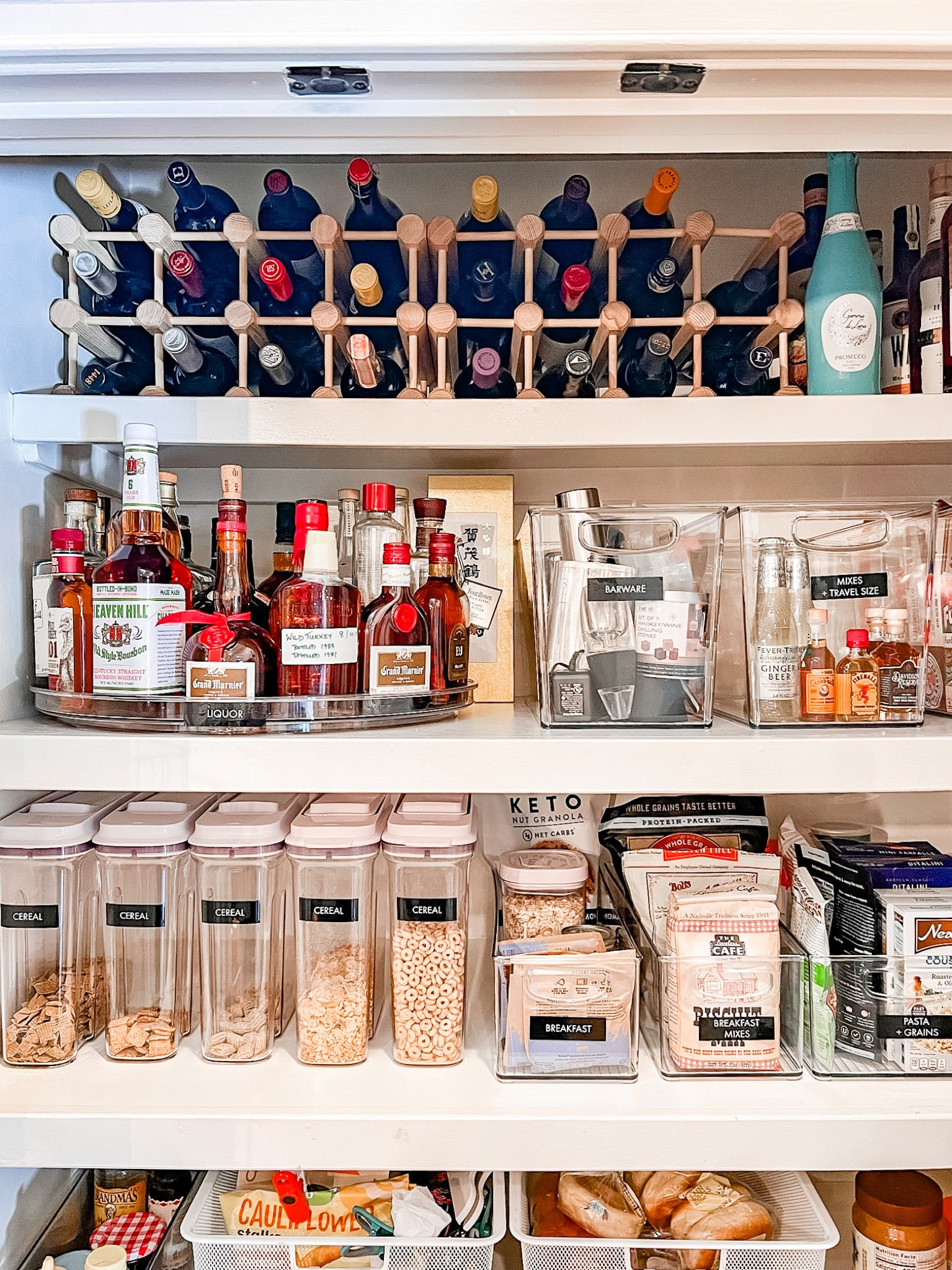 👀 This pantry is storing all the dry goods + small appliances + alcohol + bar ware! The possibilities are endless when you have a great design and use the right space and accessories! How fun is the turntable?? 🤩 

#LTKfamily #LTKstyletip #LTKhome